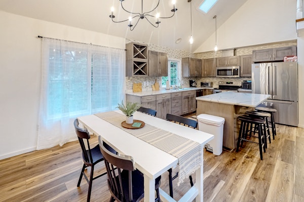 Renovated three story home by the beach with a furnished deck and washer dryer