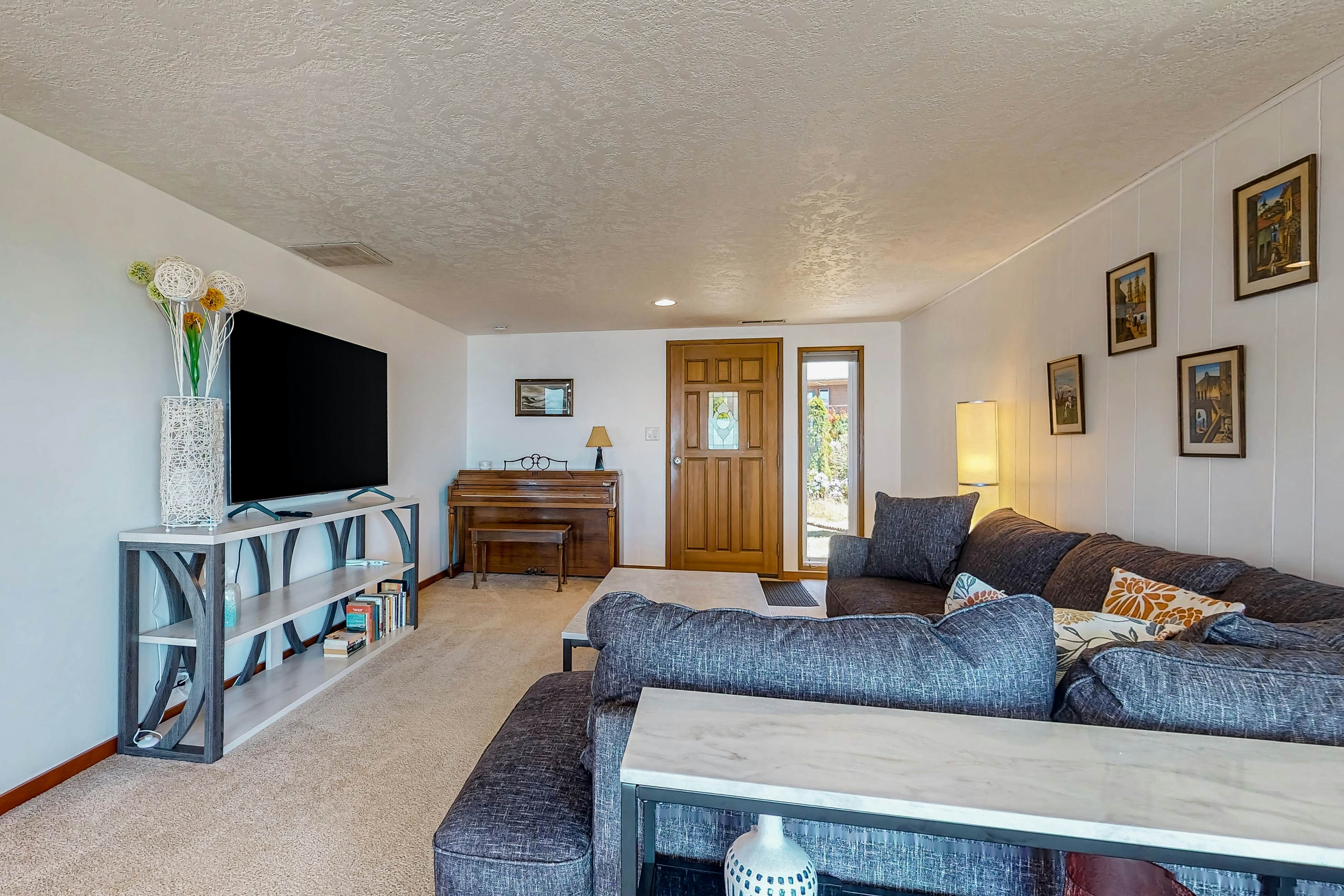 Ocean-view dog-friendly home with hot tub, large lawn, home office, & Ping-Pong