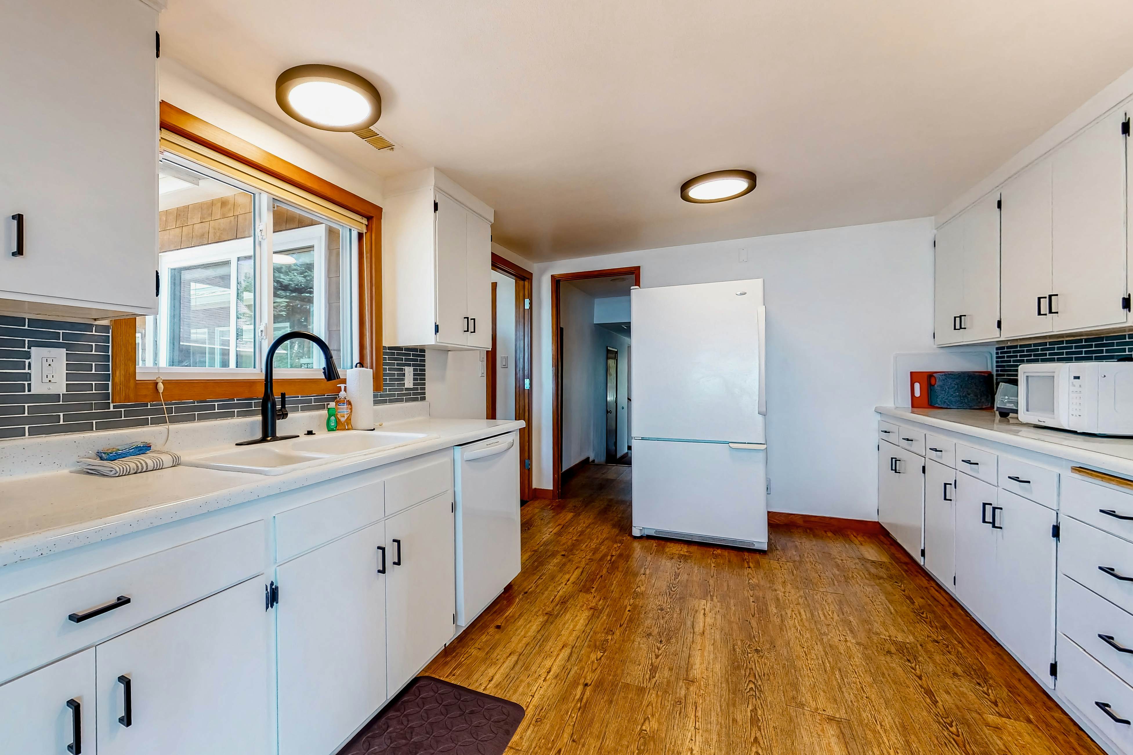 Ocean-view dog-friendly home with hot tub, large lawn, home office, & Ping-Pong