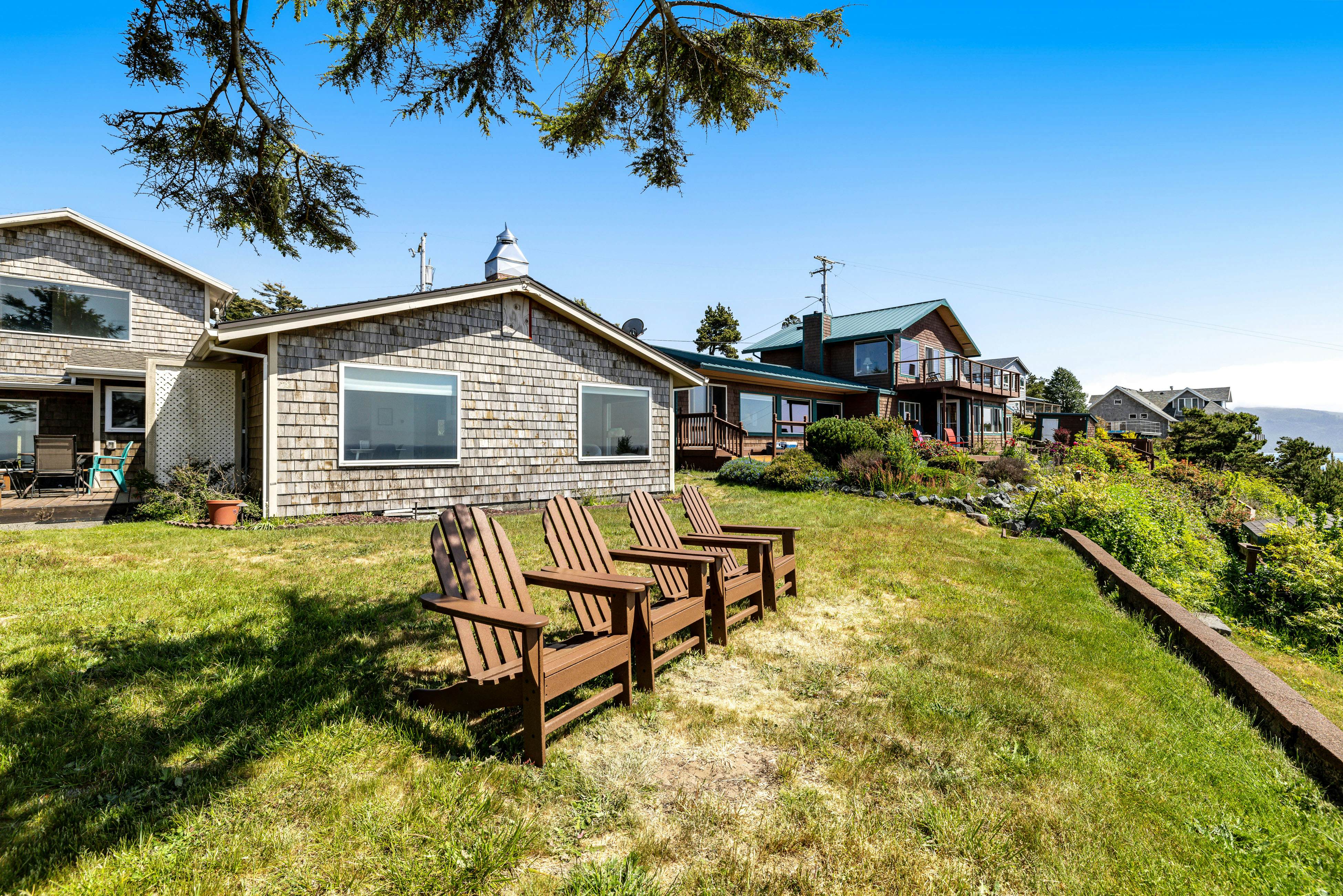 Ocean-view dog-friendly home with hot tub, large lawn, home office, & Ping-Pong