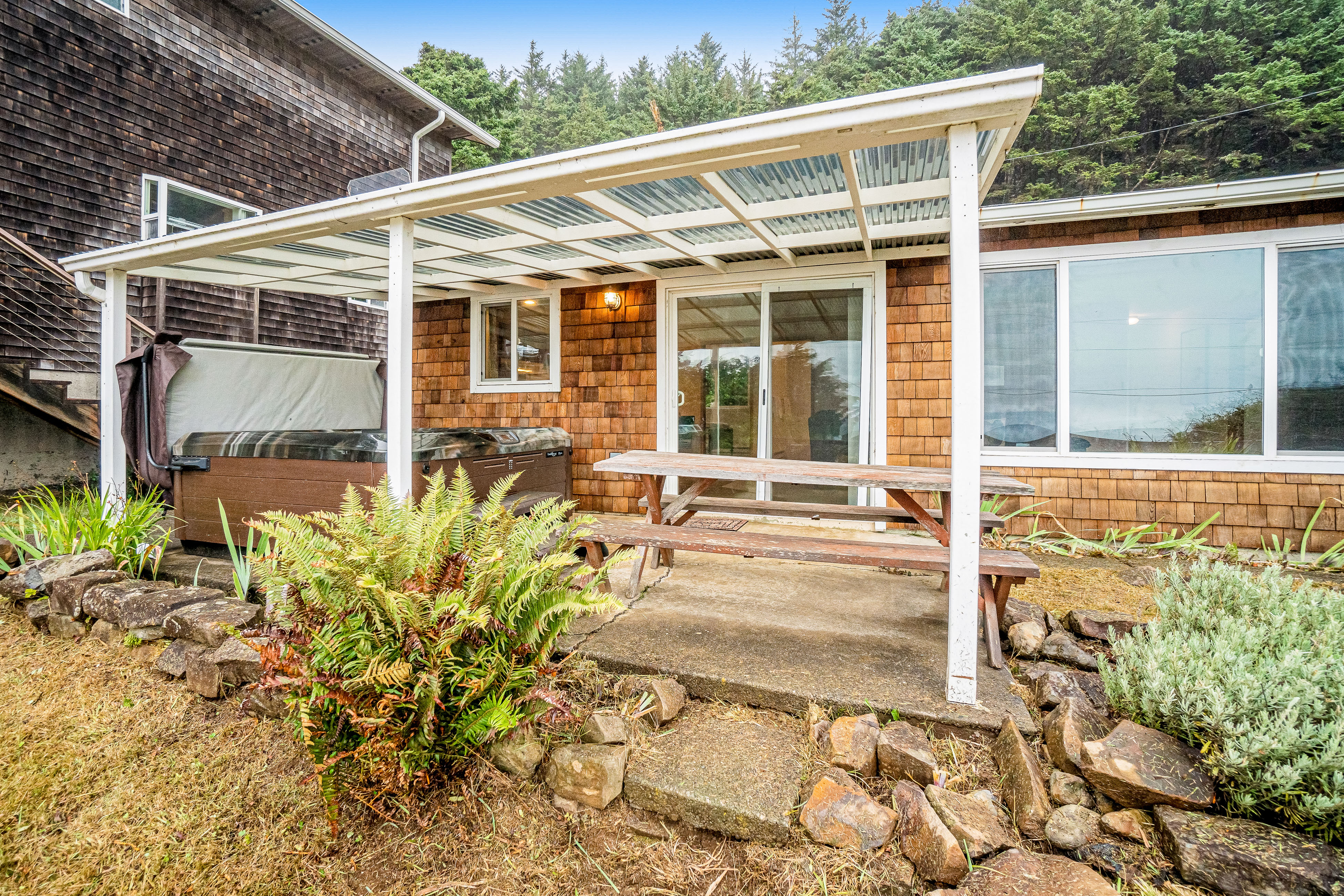 Cozy dog friendly home with ocean views a private hot tub and washer and dryer