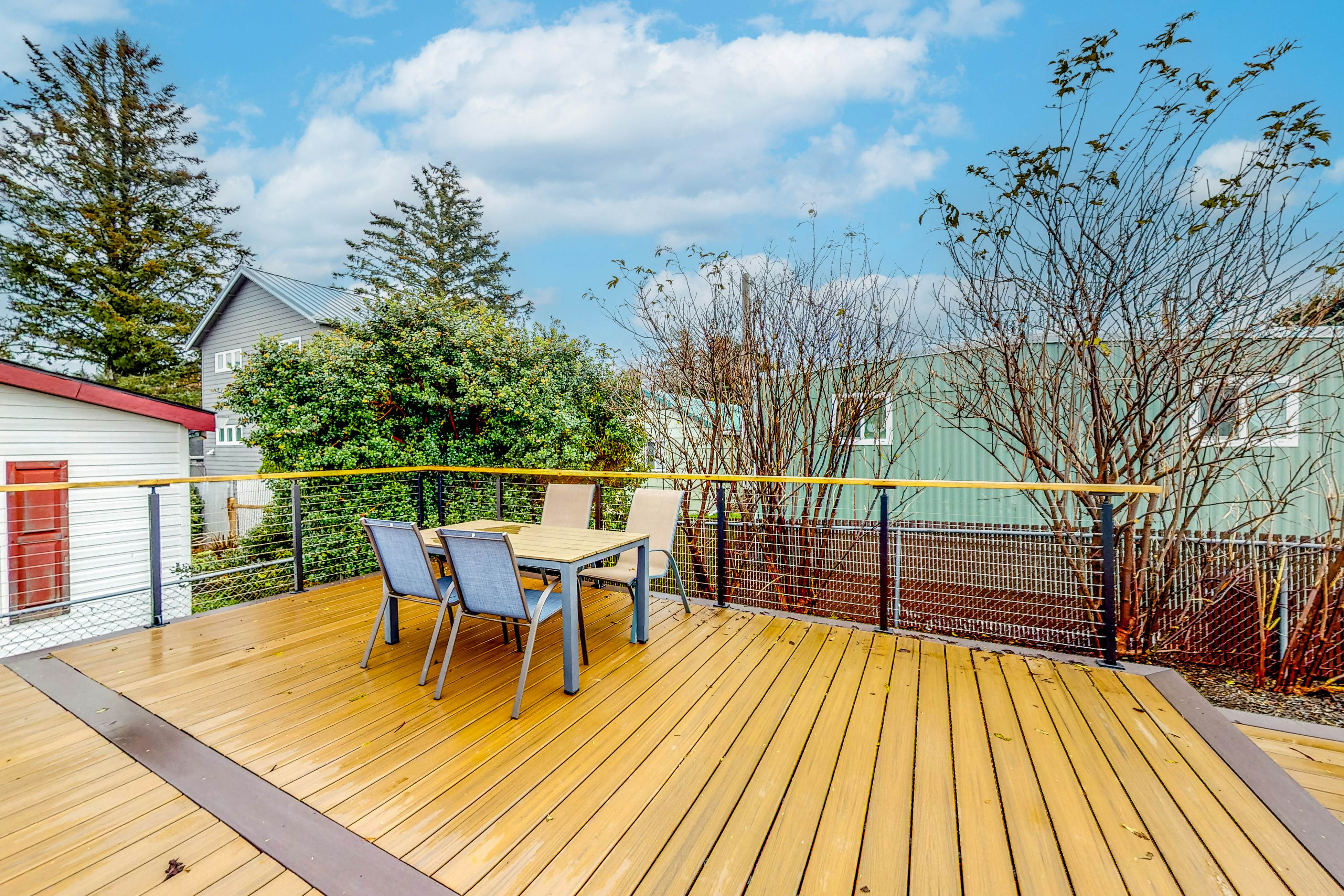 Renovated, dog-friendly cottage with a covered porch, deck, yard, & washer/dryer