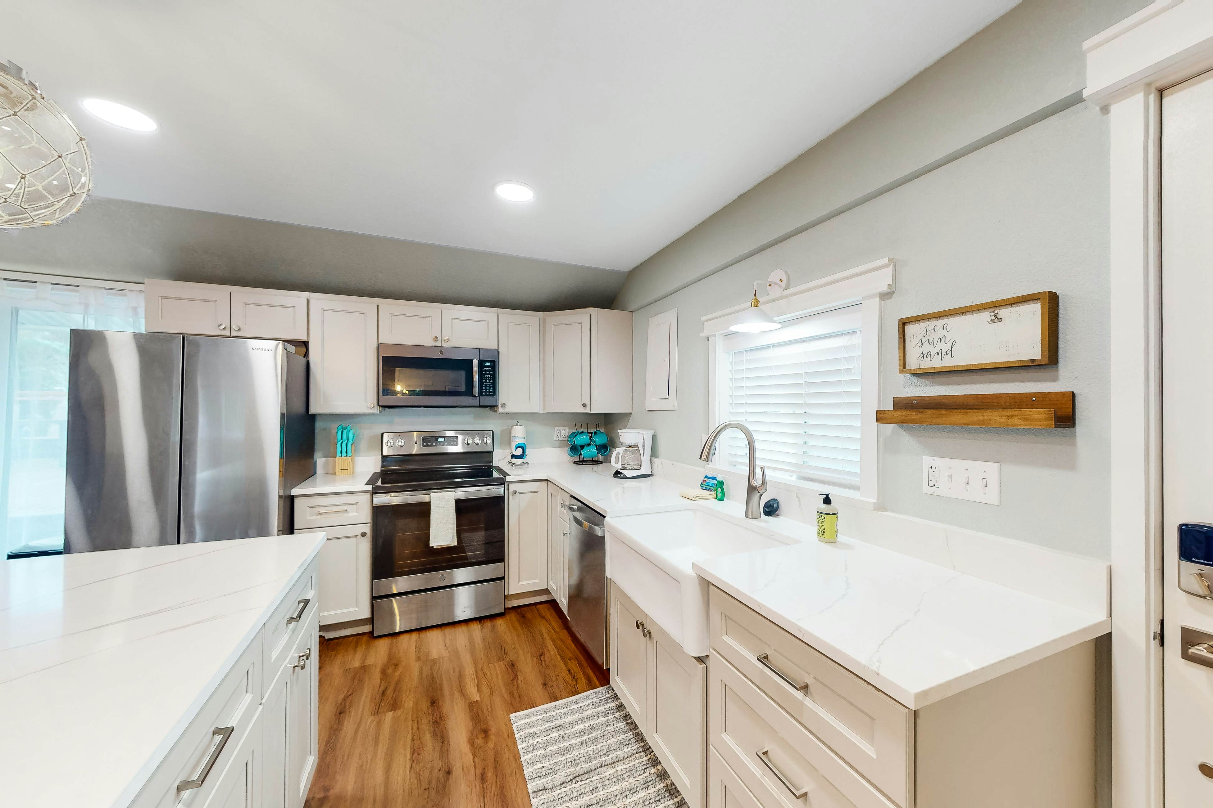 Renovated, dog-friendly cottage with a covered porch, deck, yard, & washer/dryer