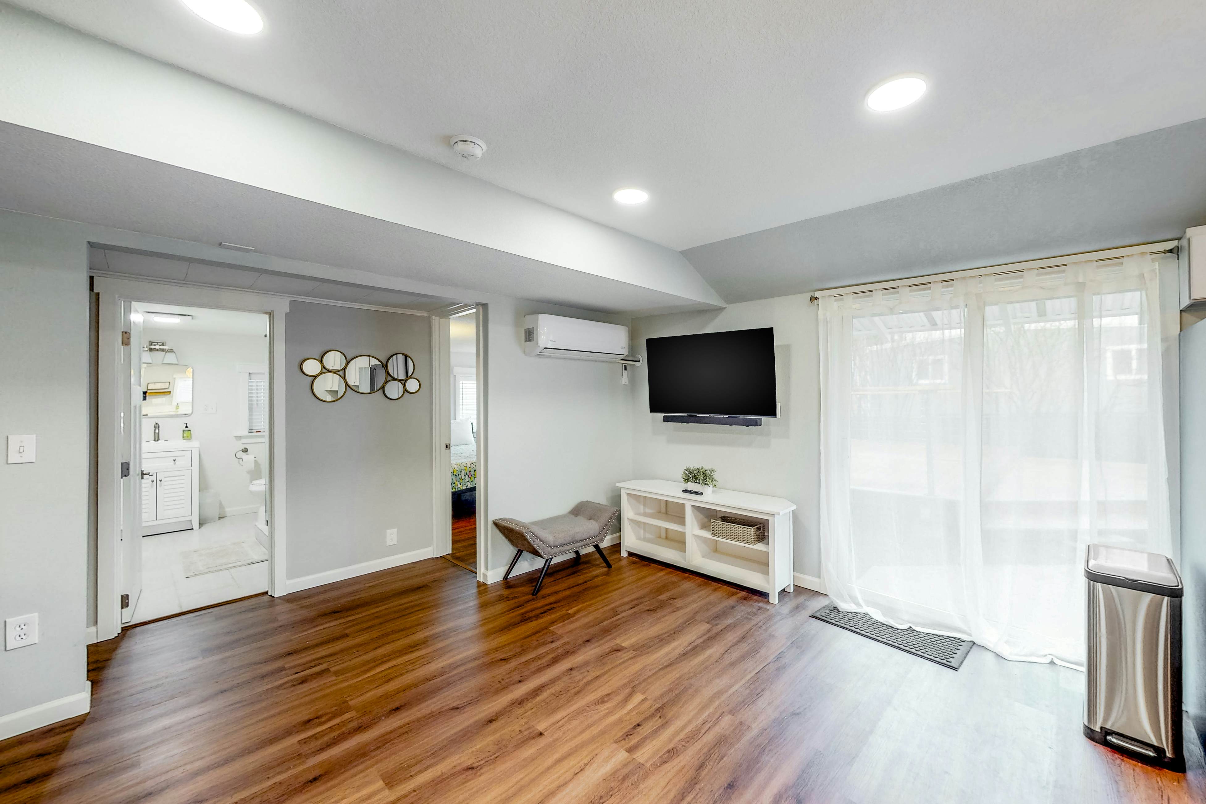 Renovated, dog-friendly cottage with a covered porch, deck, yard, & washer/dryer