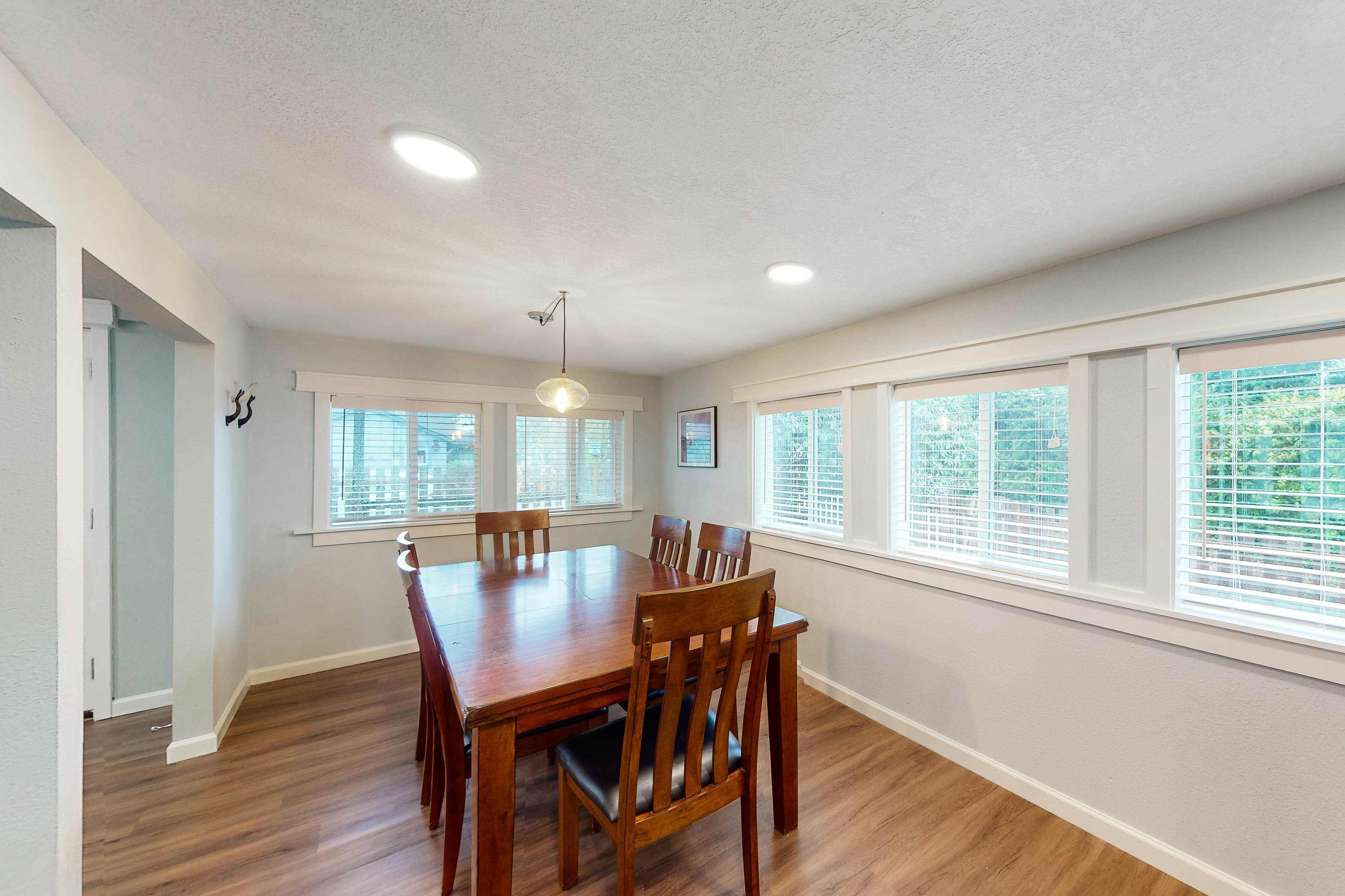 Renovated, dog-friendly cottage with a covered porch, deck, yard, & washer/dryer