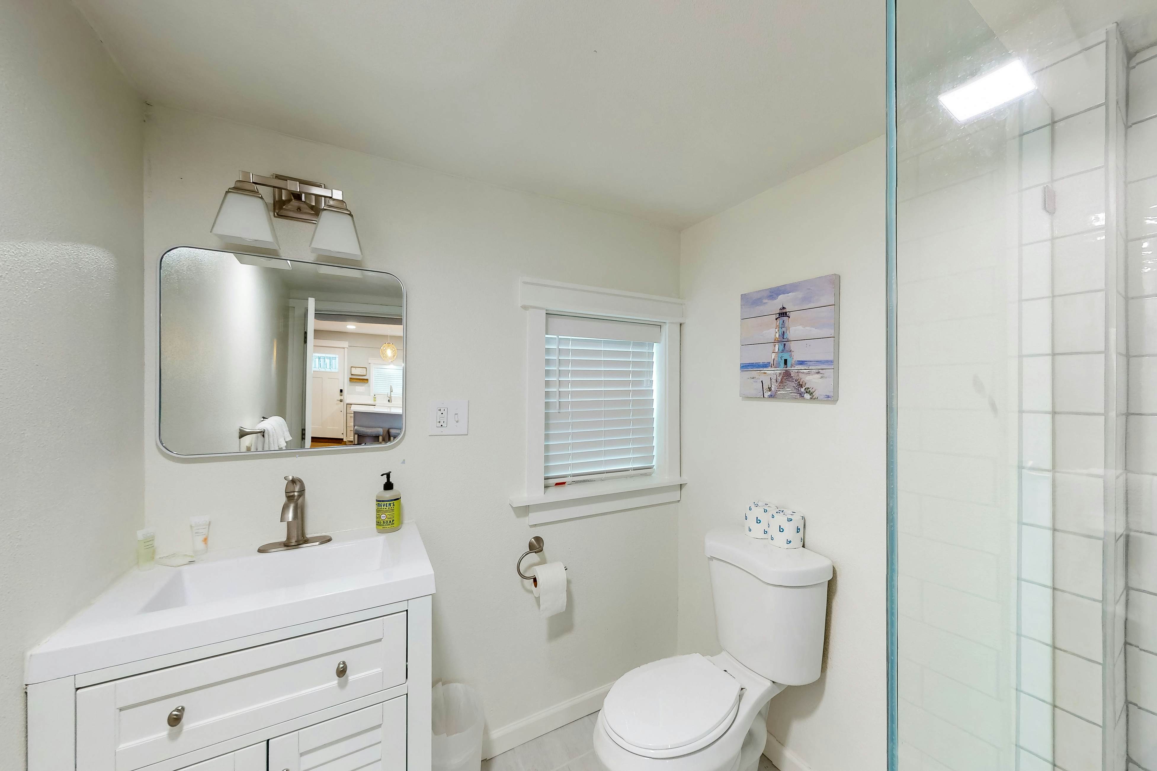 Renovated, dog-friendly cottage with a covered porch, deck, yard, & washer/dryer