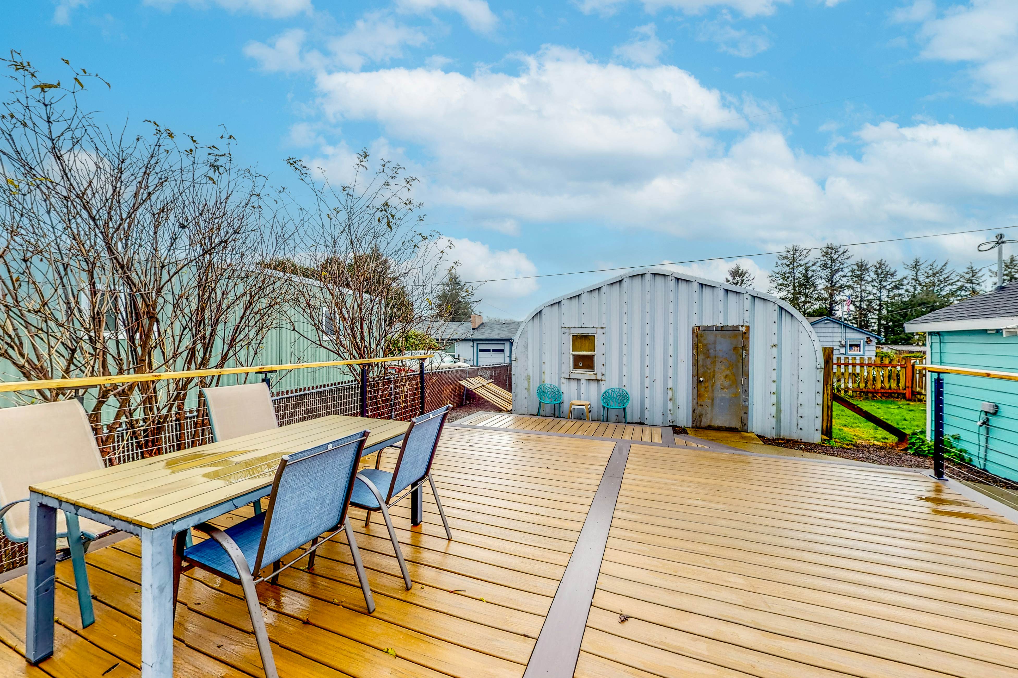 Renovated, dog-friendly cottage with a covered porch, deck, yard, & washer/dryer