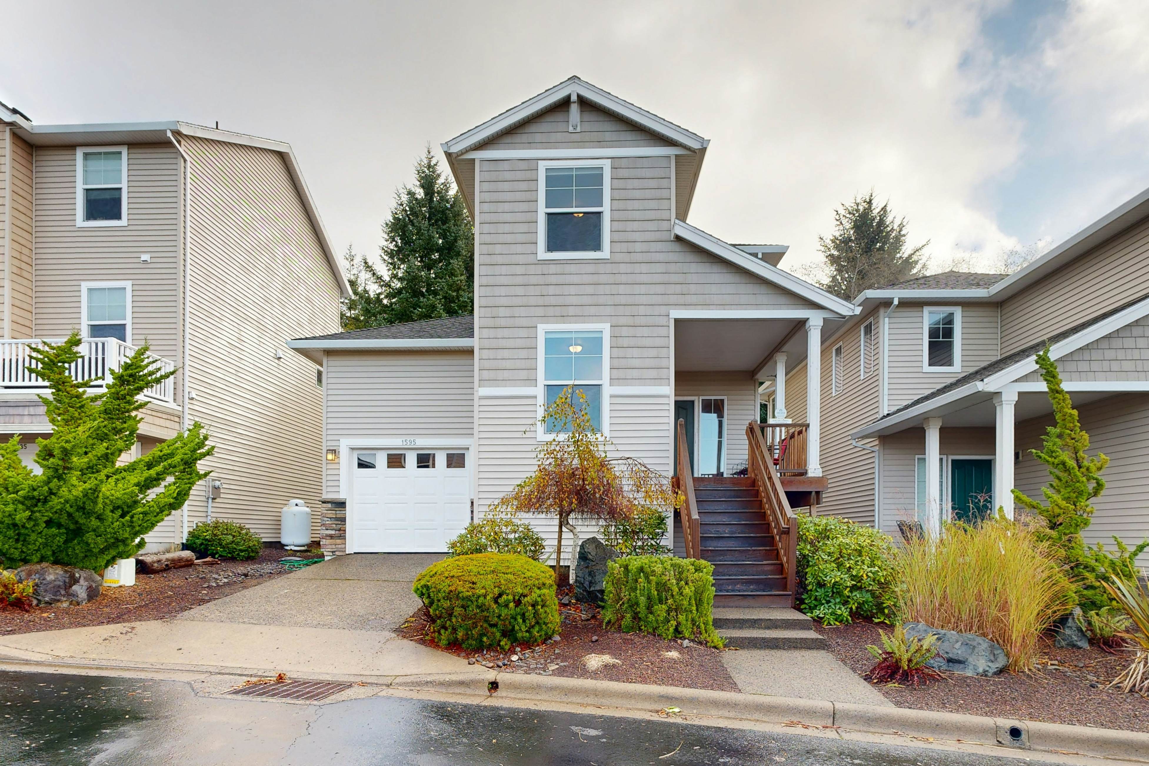 Modern Ocean Highlands home with Netarts Bay & ocean views, fireplace - dogs OK