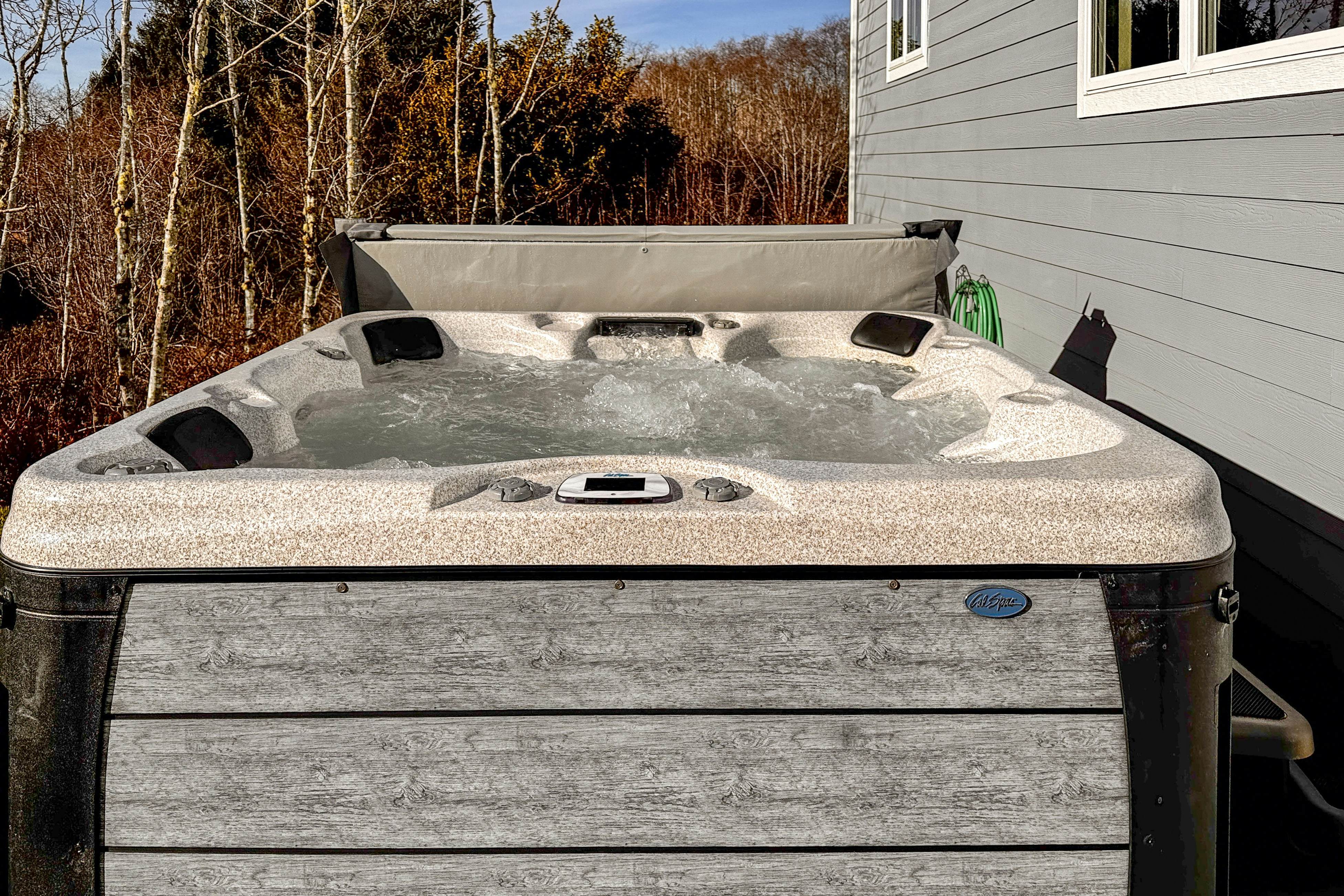 Comfortable home with ocean views with private hot tub deck fireplace WiFi