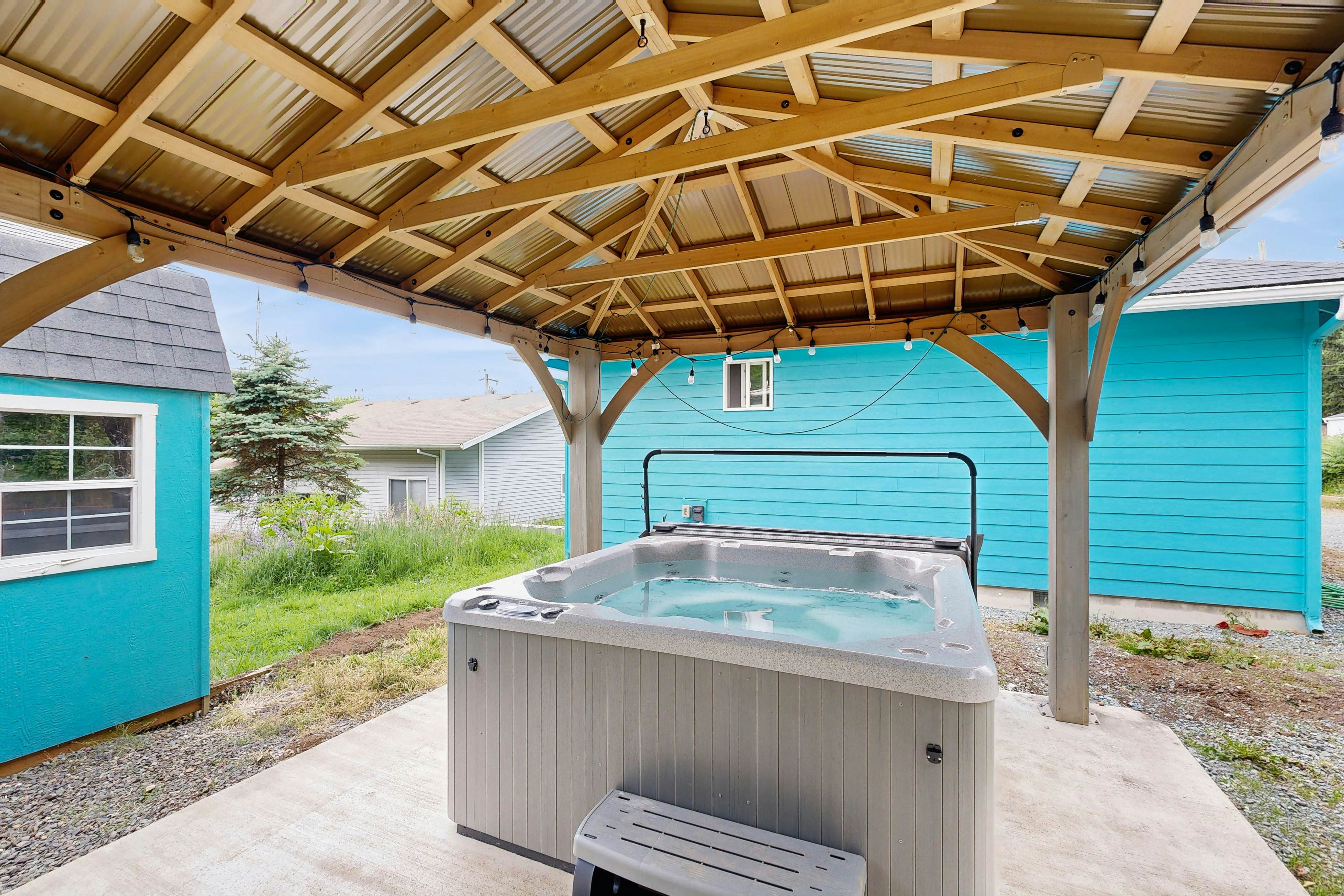 Modern Beach Cottage with a covered patio fire pit grill and easy beach access