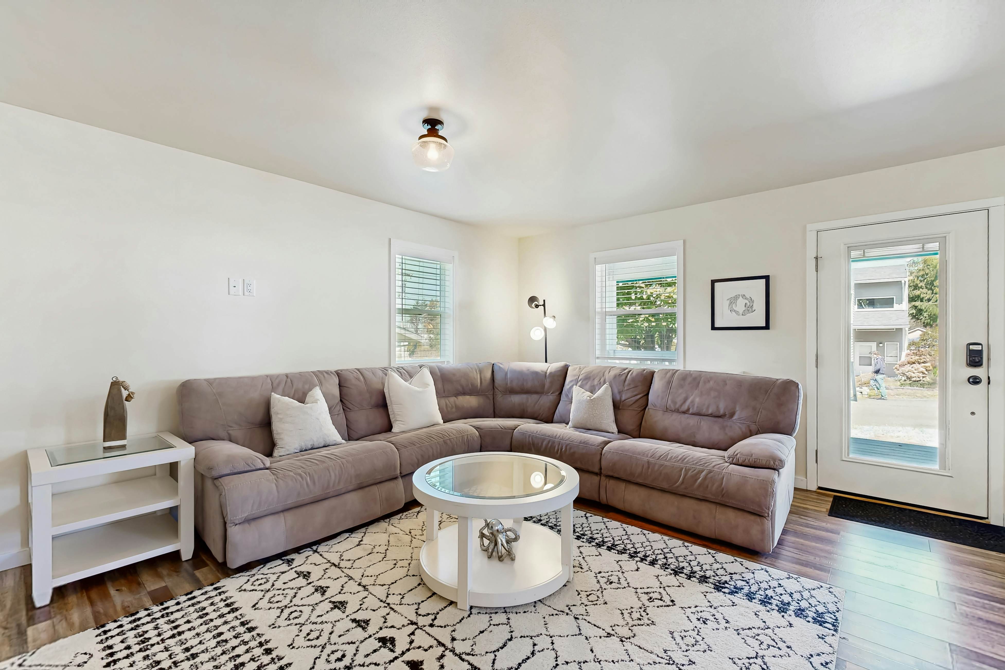 Modern Beach Cottage with a covered patio fire pit grill and easy beach access