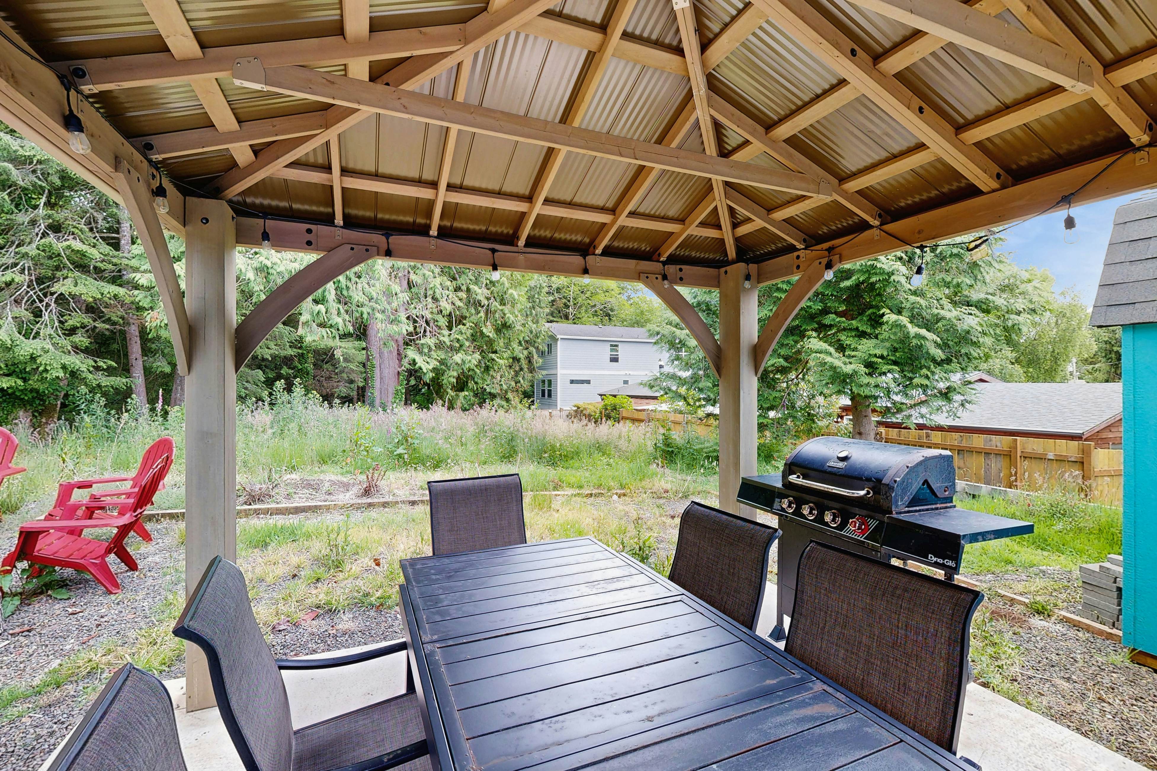 Modern Beach Cottage with a covered patio fire pit grill and easy beach access