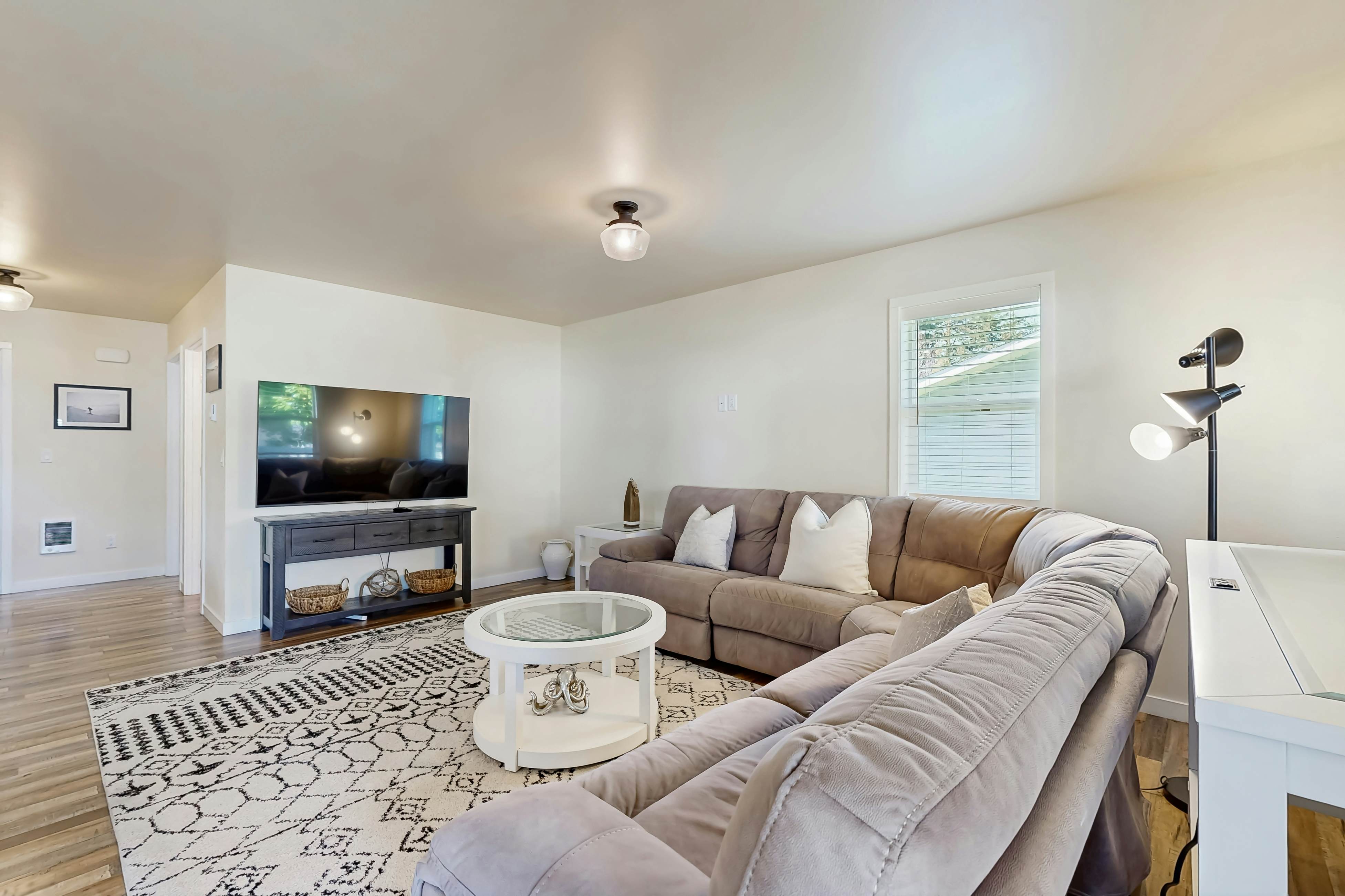 Modern Beach Cottage with a covered patio fire pit grill and easy beach access