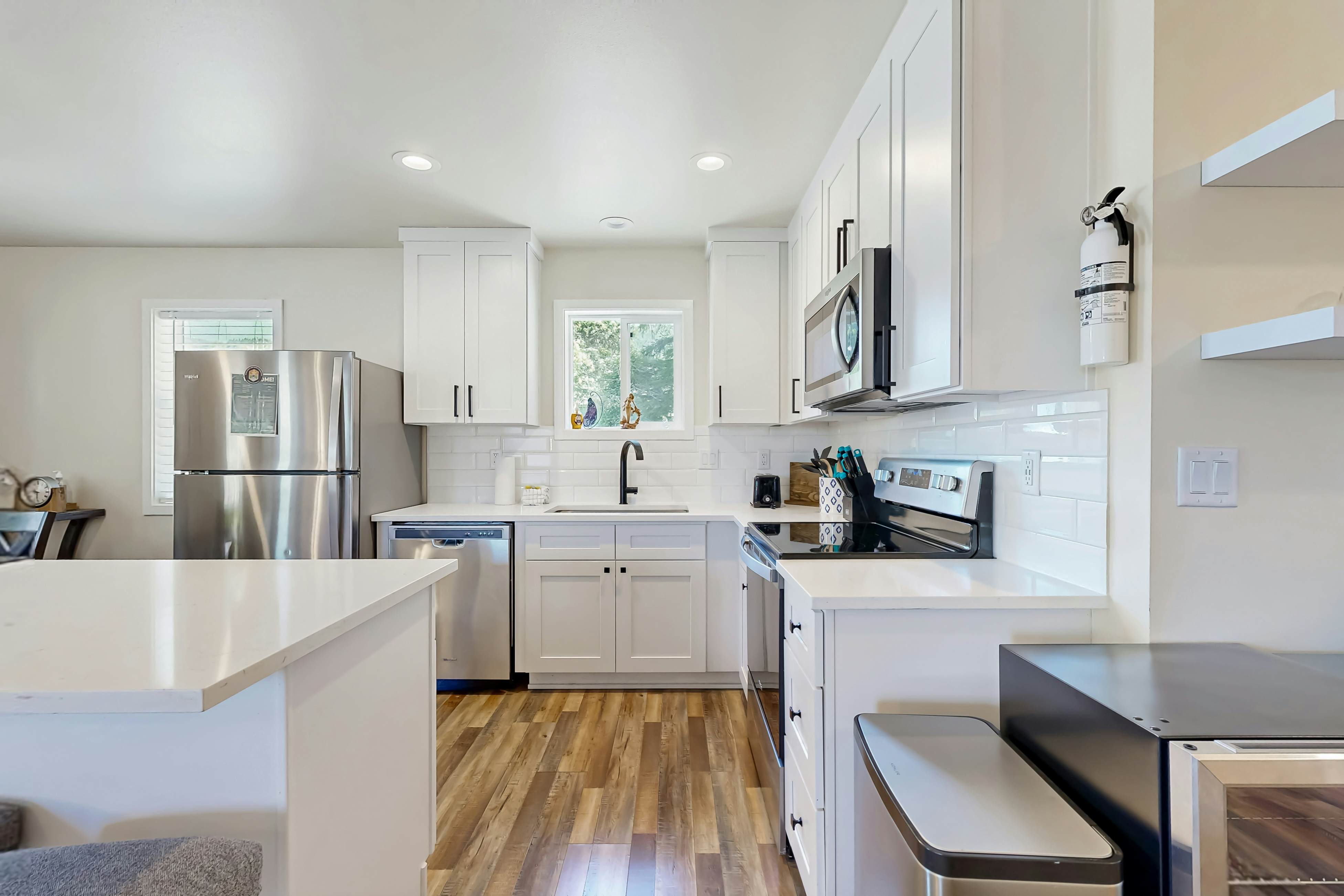 Modern Beach Cottage with a covered patio fire pit grill and easy beach access