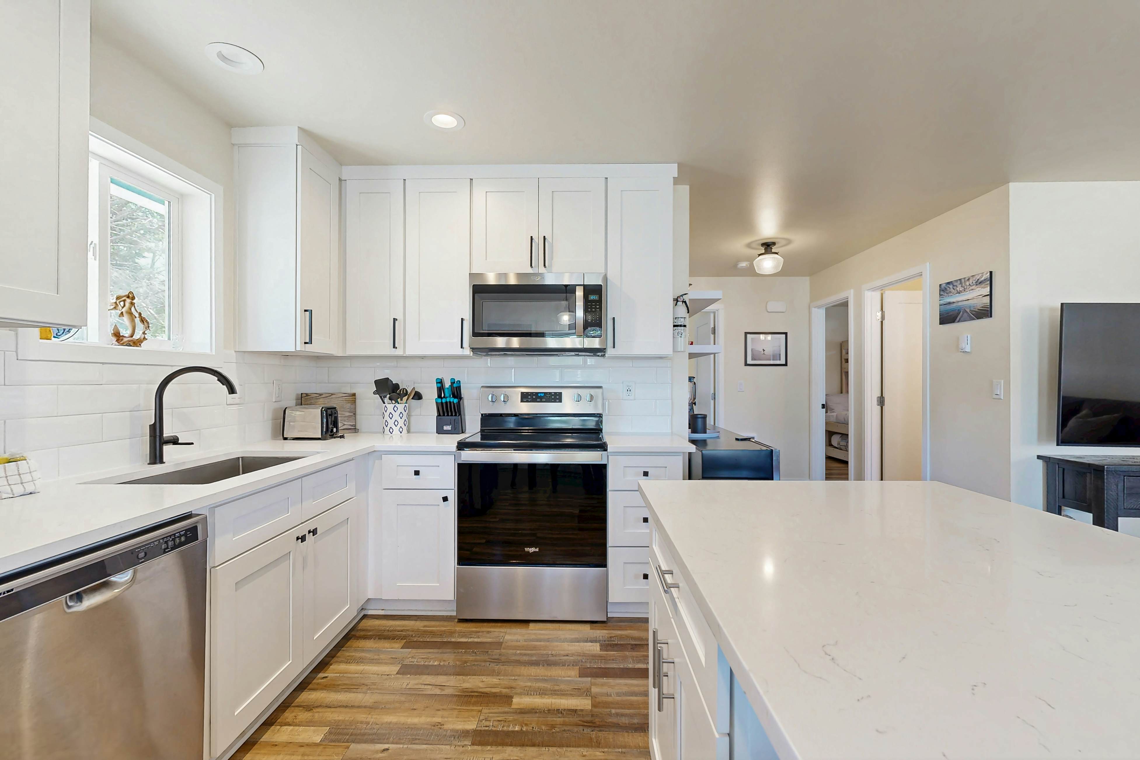 Modern Beach Cottage with a covered patio fire pit grill and easy beach access