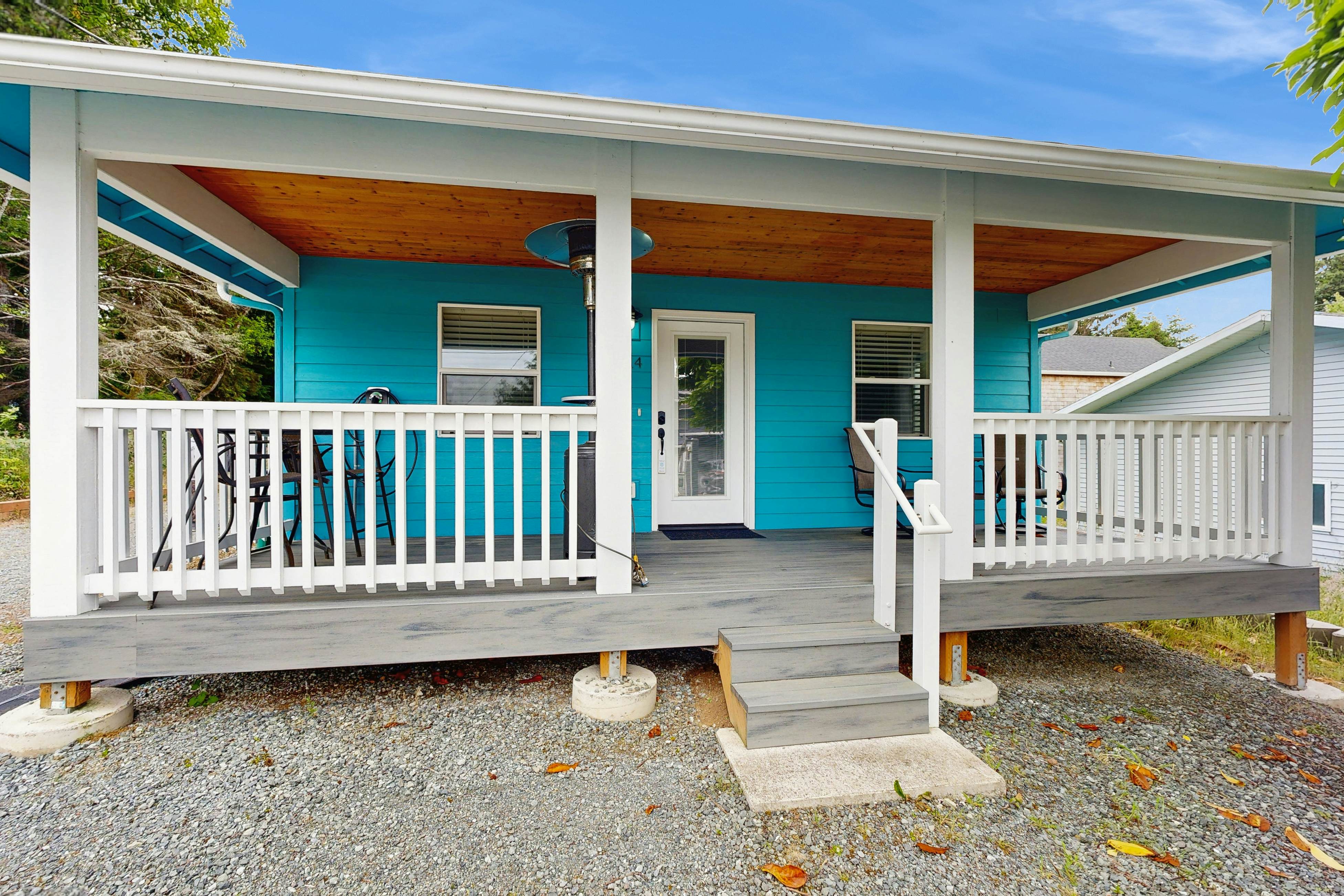 Modern Beach Cottage with a covered patio fire pit grill and easy beach access