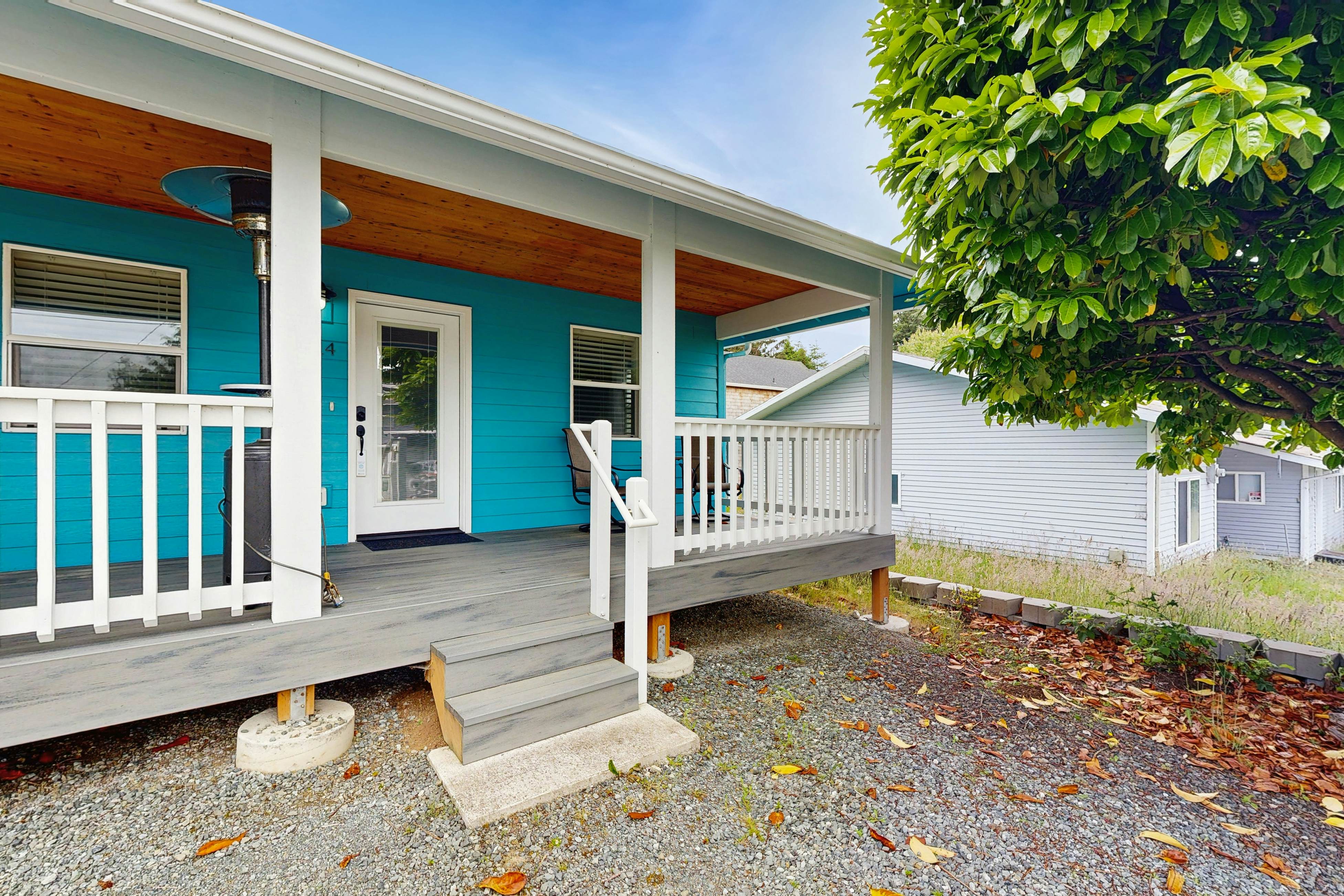Modern Beach Cottage with a covered patio fire pit grill and easy beach access
