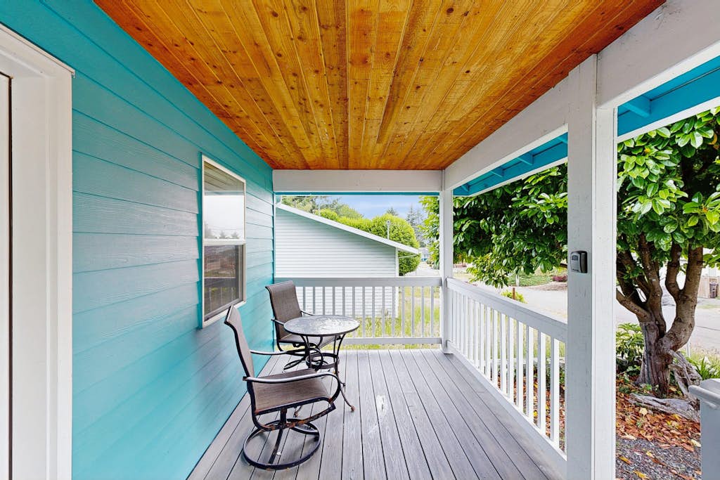 Modern Beach Cottage with a covered patio fire pit grill and easy beach access