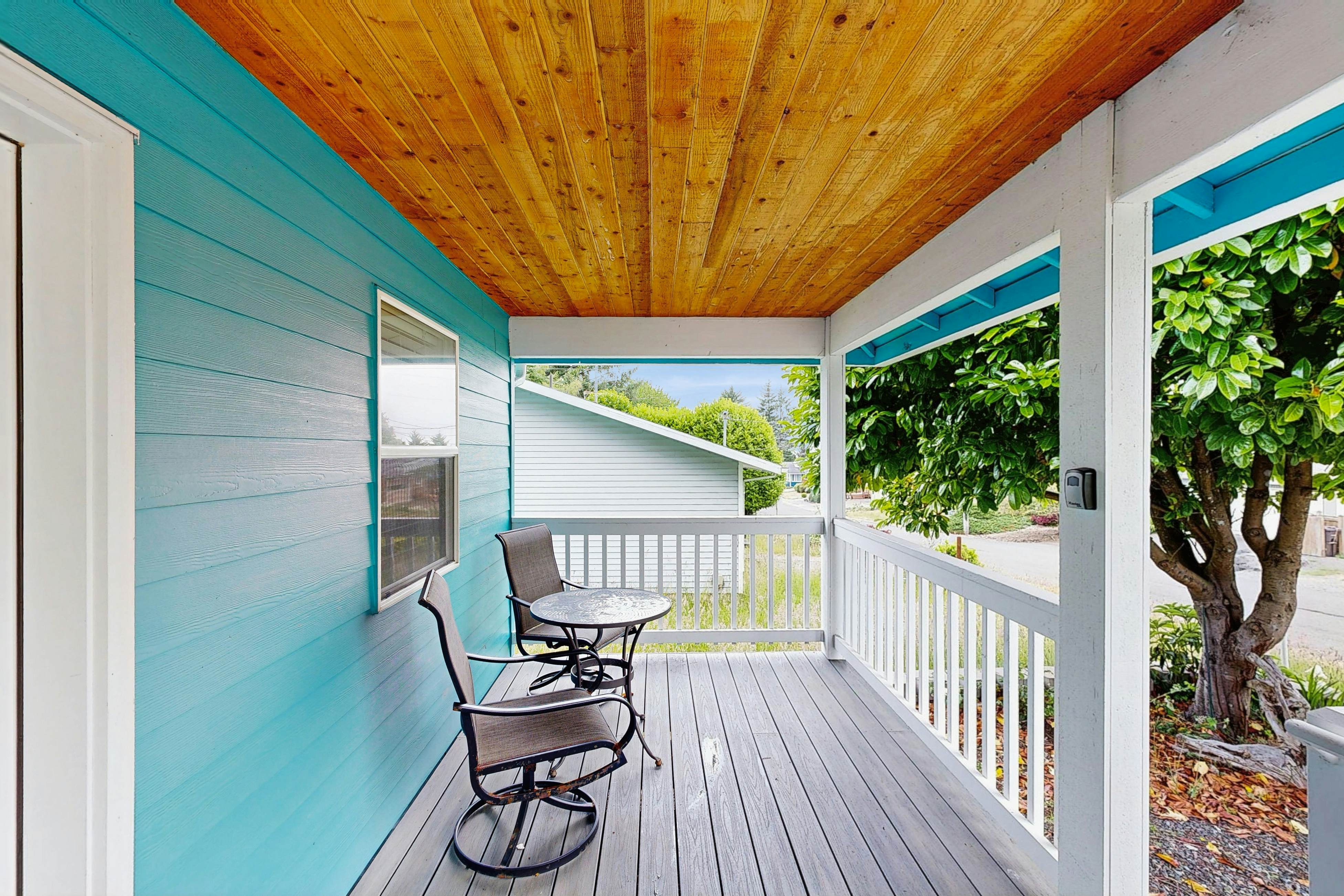 Modern Beach Cottage with a covered patio fire pit grill and easy beach access