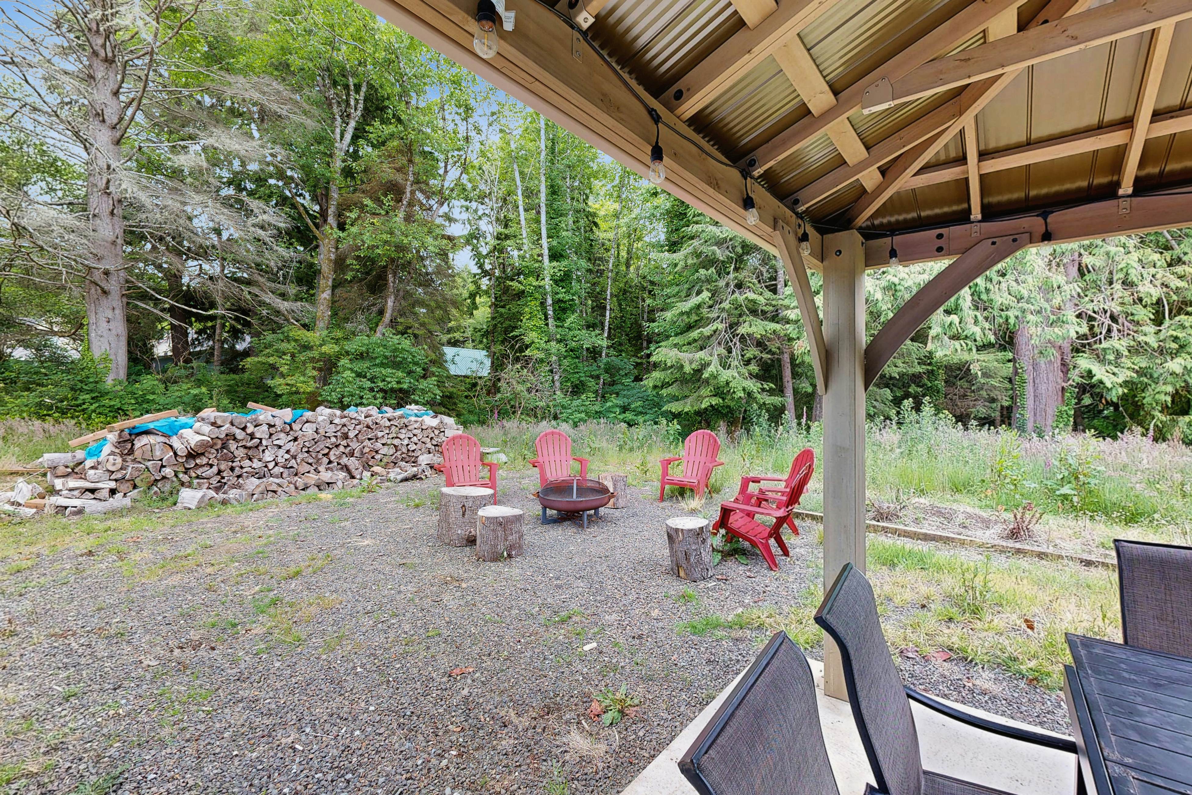 Modern Beach Cottage with a covered patio fire pit grill and easy beach access