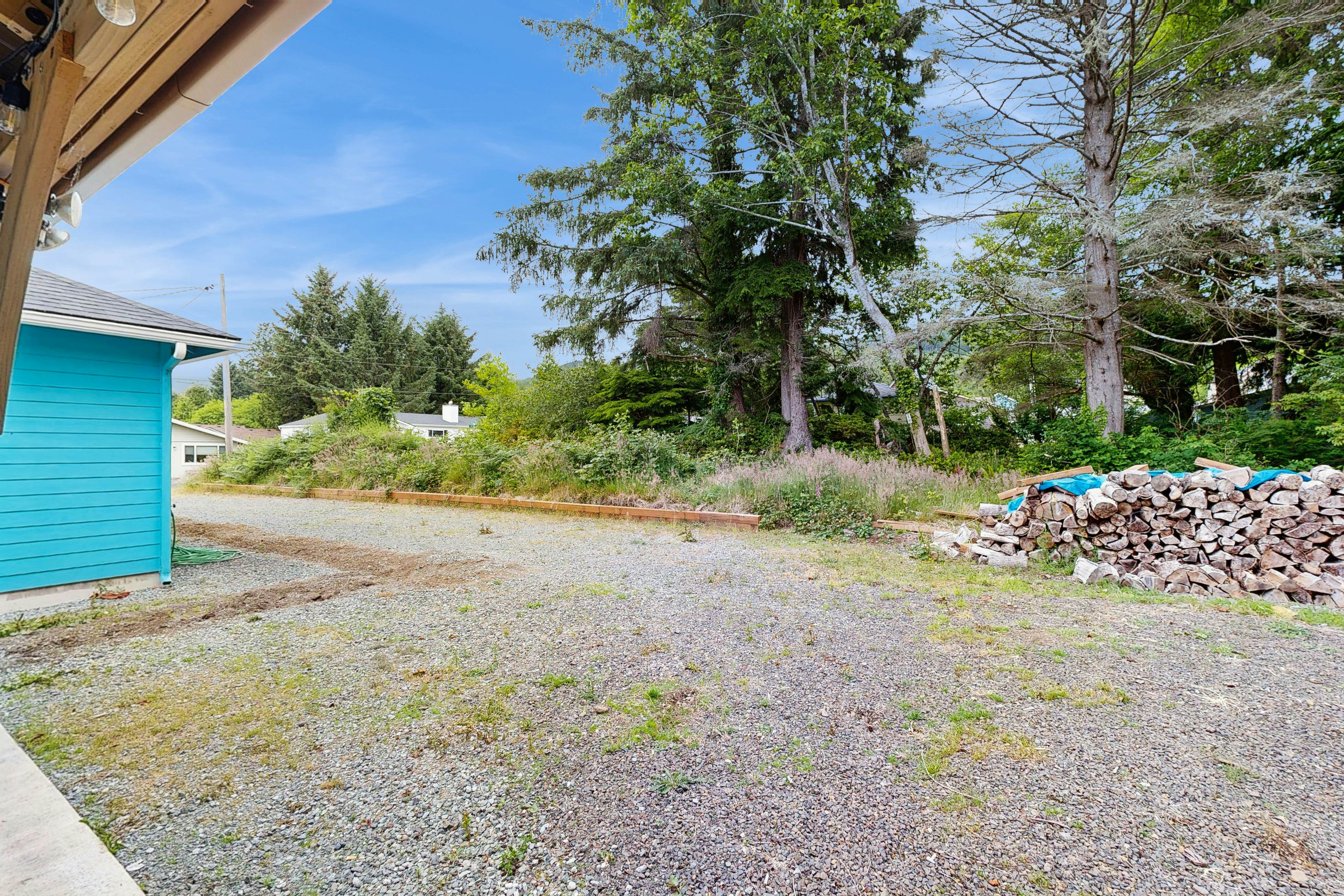 Modern Beach Cottage with a covered patio fire pit grill and easy beach access