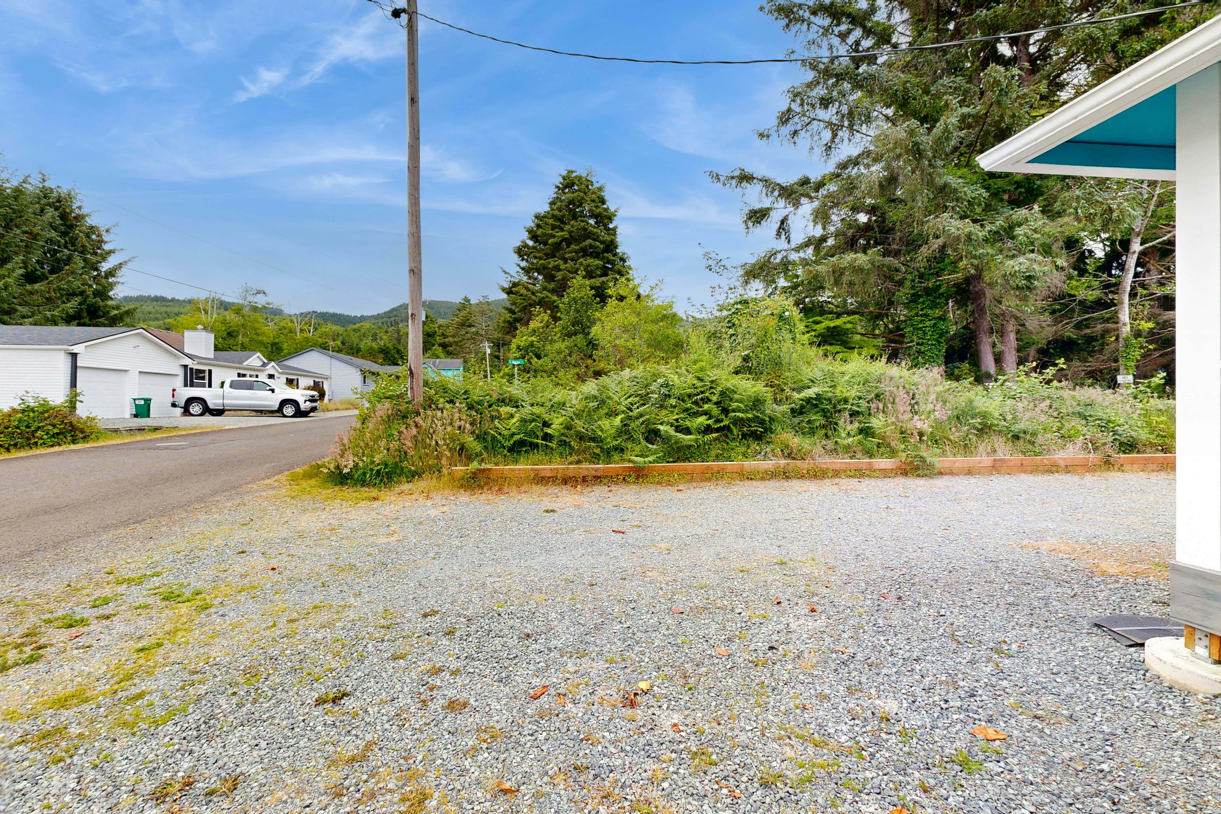 Modern Beach Cottage with a covered patio fire pit grill and easy beach access