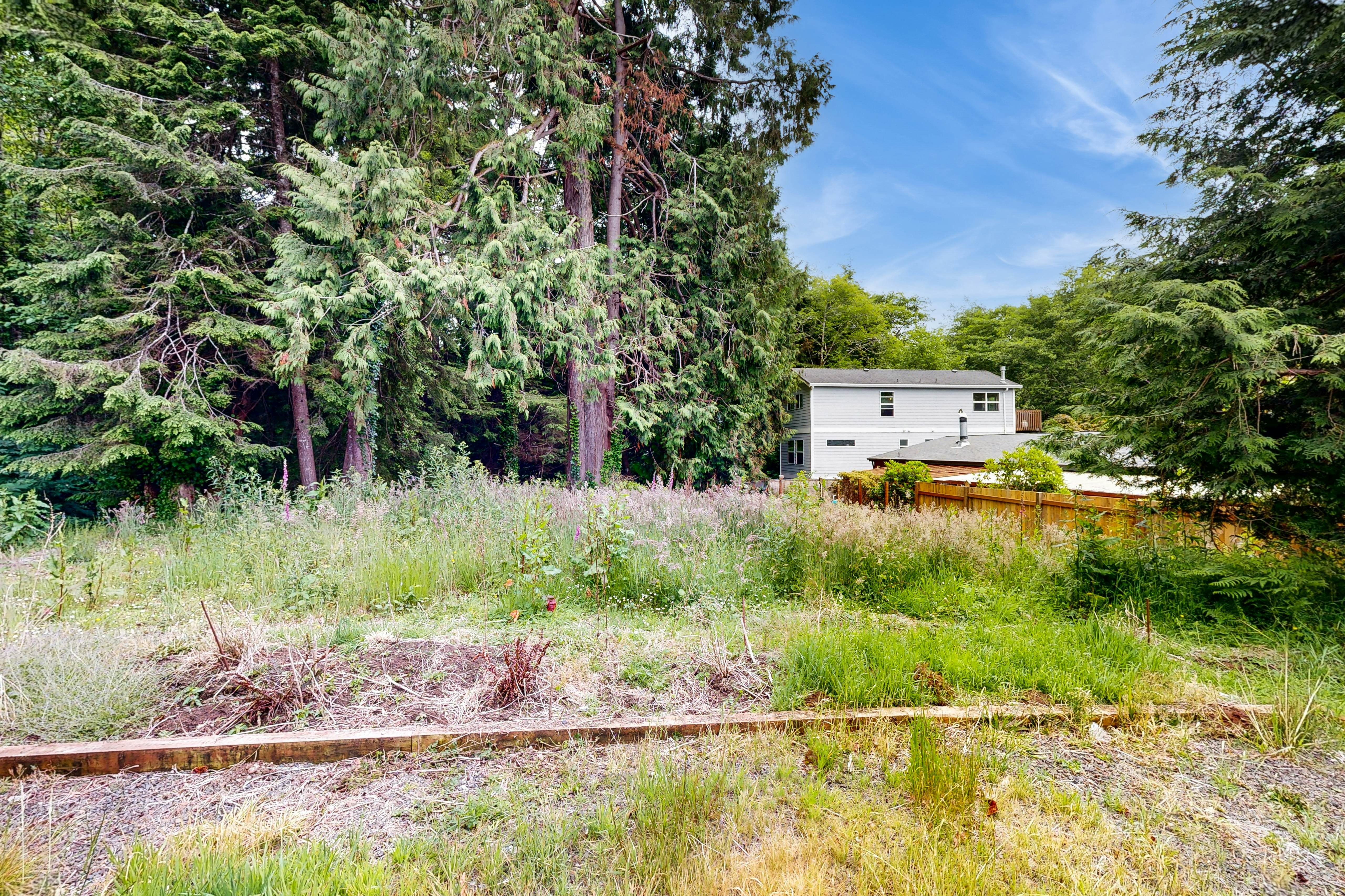 Modern Beach Cottage with a covered patio fire pit grill and easy beach access