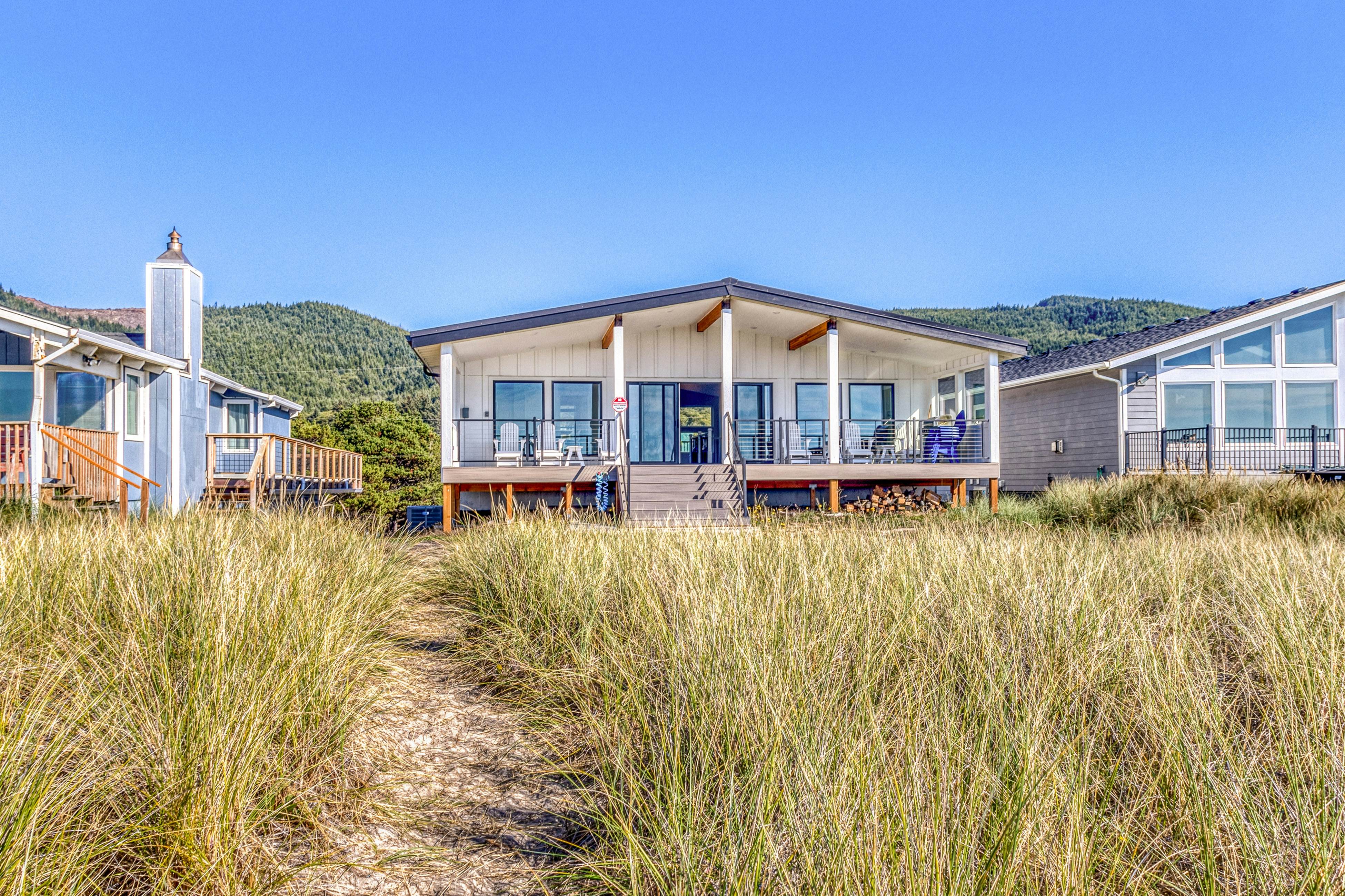 Beautiful beachfront home with huge ocean view beach access and large deck