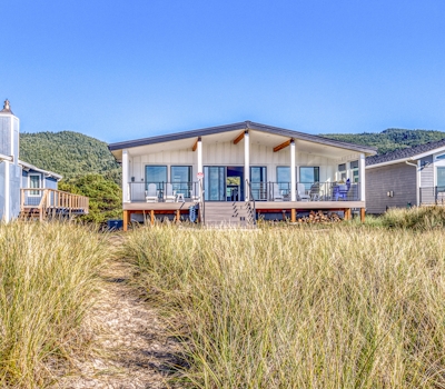 Beautiful beachfront home with huge ocean view beach access and large deck