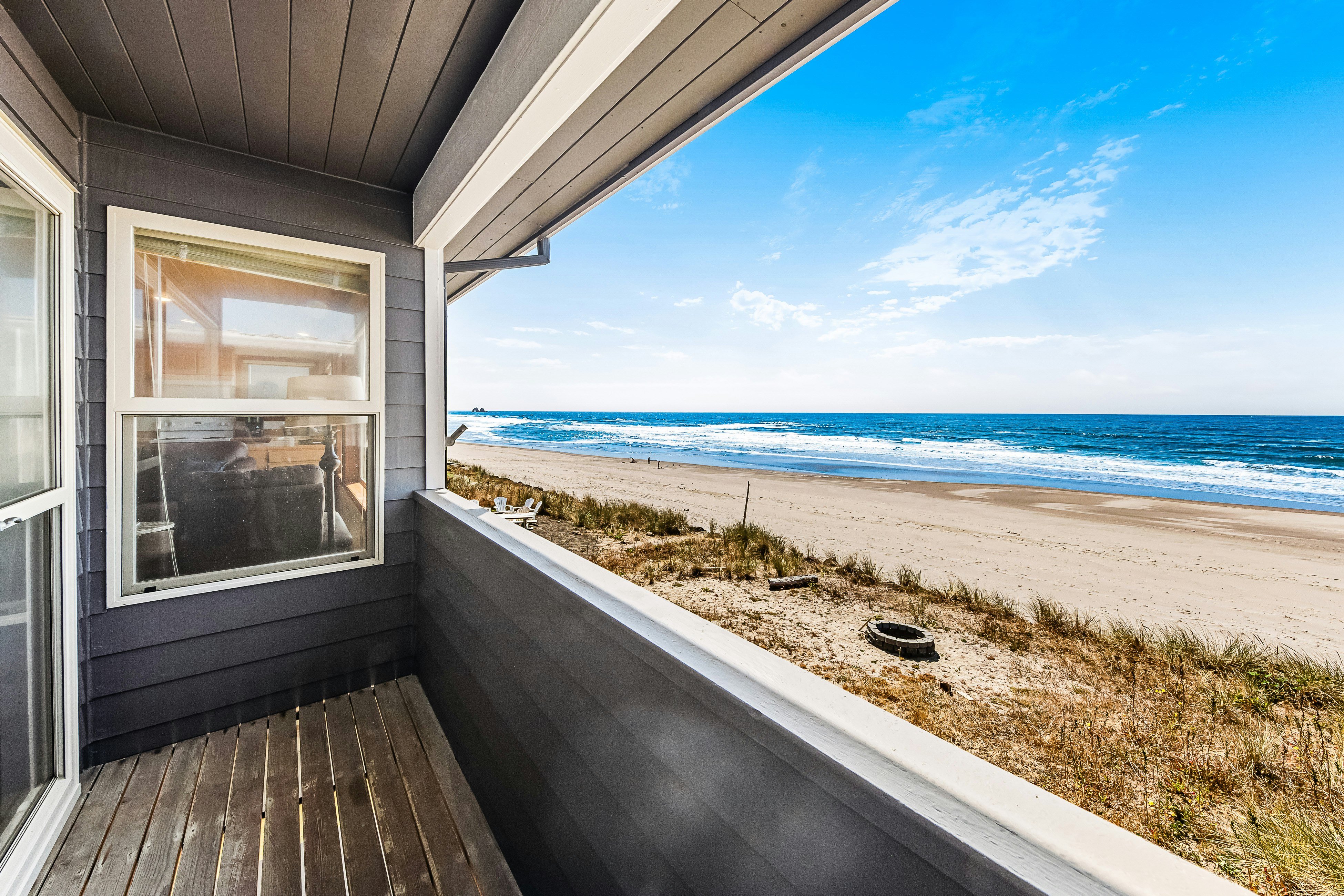 Two-story oceanfront retreat with a washer/dryer, firepit, & Ping-Pong table