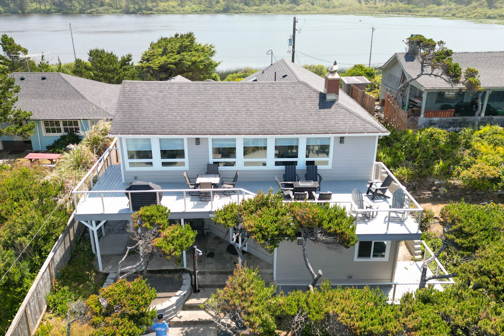 Renovated lake ocean view retreat with hot tub outdoor living and fireplace