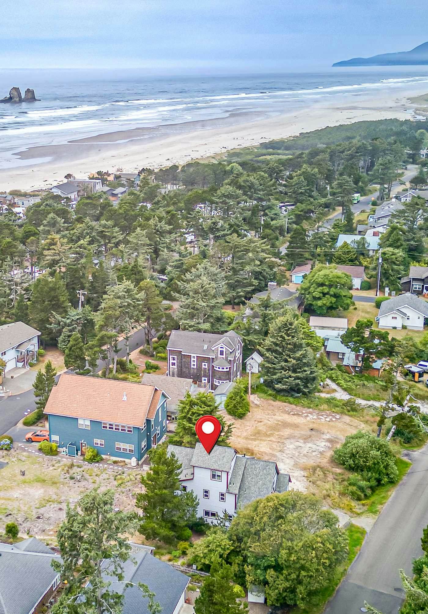 Spacious coastal retreat | 3-min walk to beach | Decks & mountain views