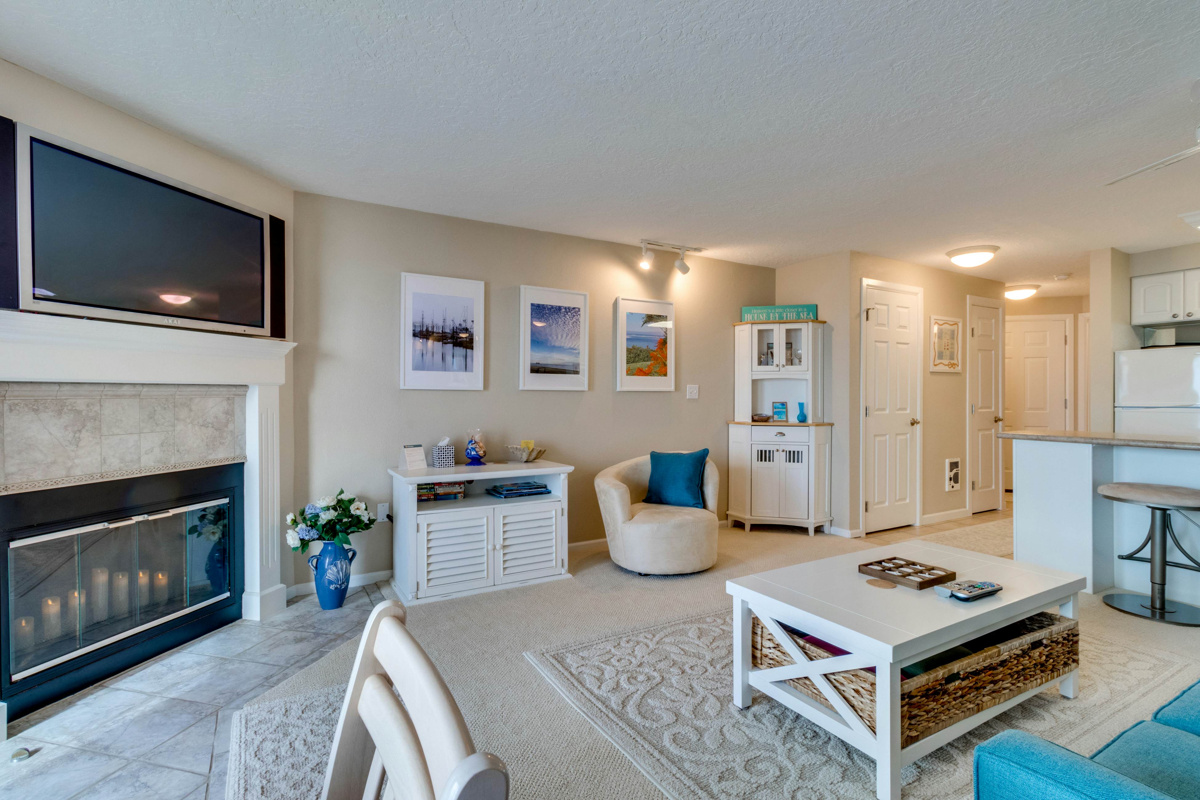 Oceanfront condo with a full kitchen, balcony, & sweeping sea views