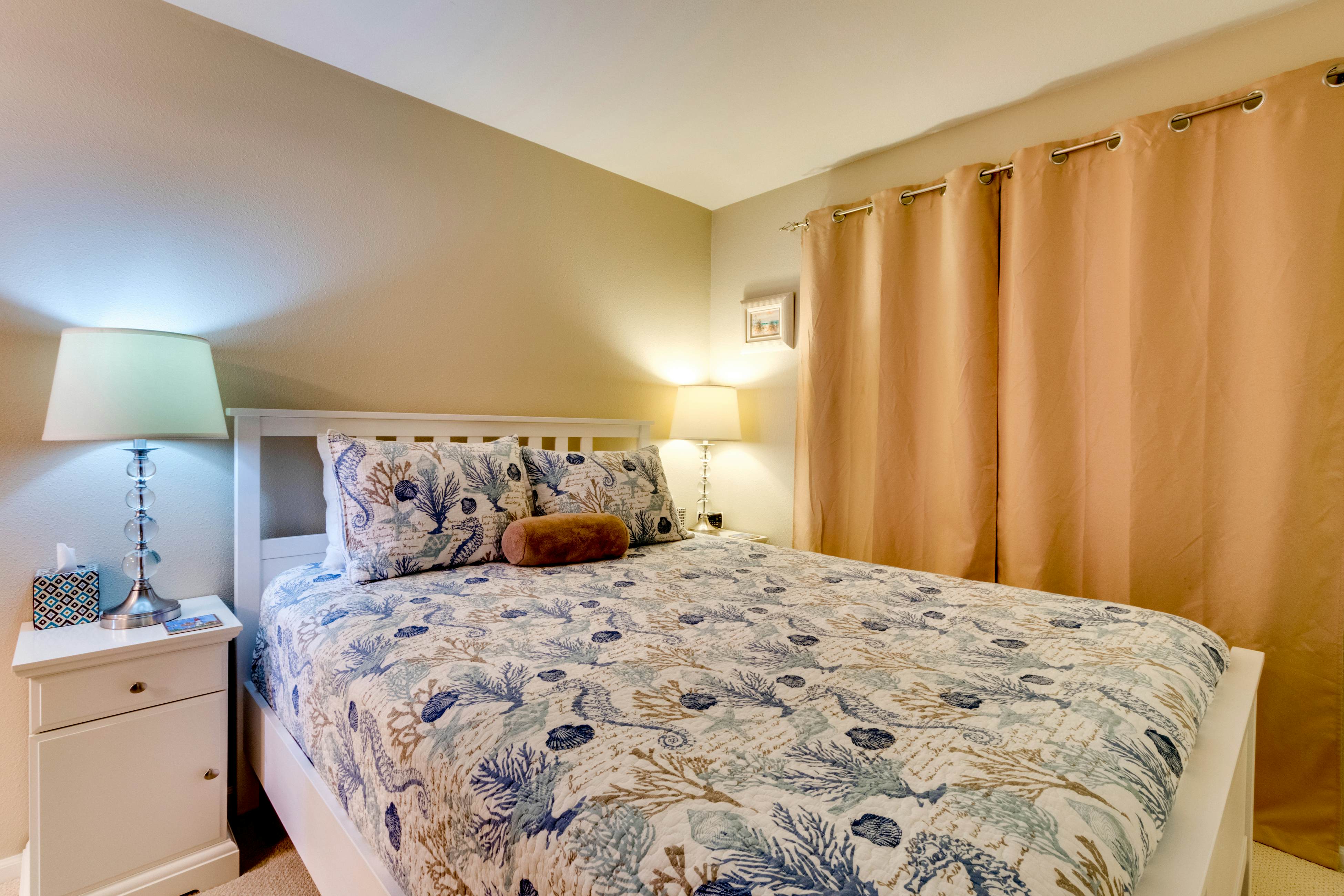 Oceanfront condo with a full kitchen, balcony, & sweeping sea views