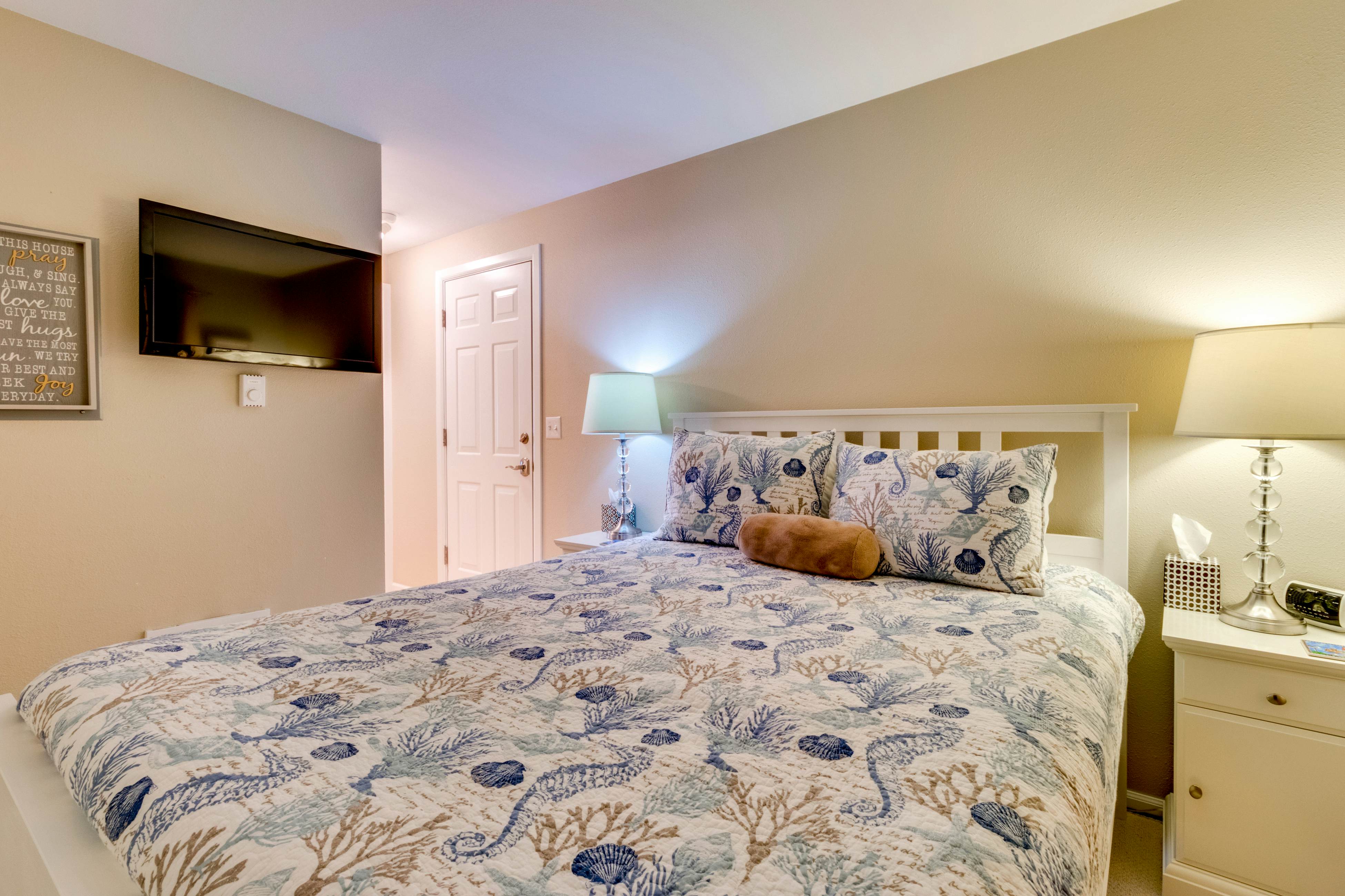 Oceanfront condo with a full kitchen, balcony, & sweeping sea views