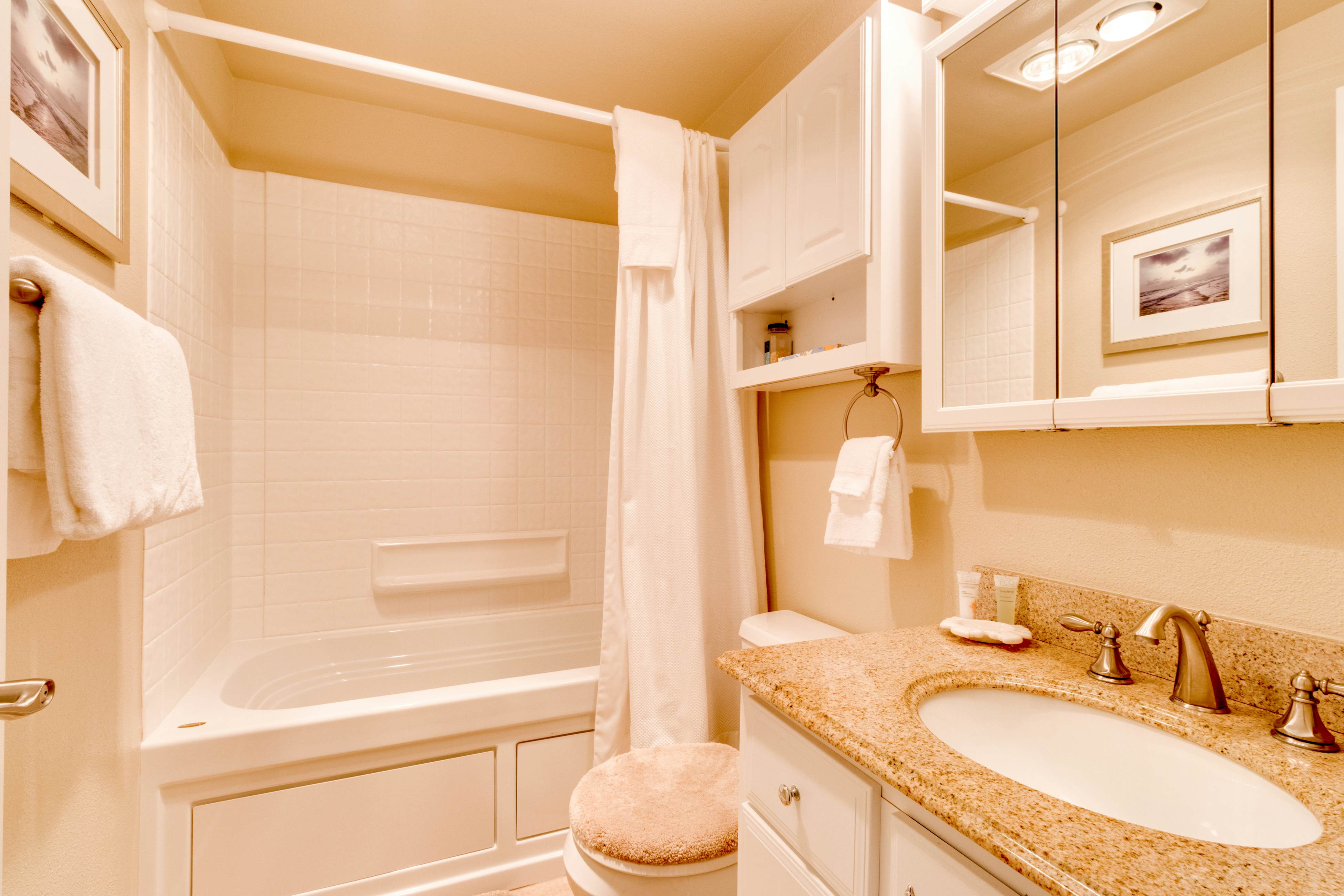 Oceanfront condo with a full kitchen, balcony, & sweeping sea views