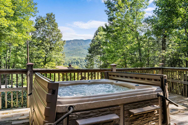 Breathtaking Mountain Color + That Down Home Feeling You’ll Crave Again and Again. Nestled in a charming Gatlinburg neighborhood, this stunning 4-bedroom log cabin sleeps 12 and is packed with experiences. Relax in the bubbling hot tub, share laughs around the table and arcade games, or simply take in breathtaking mountain color from your deck. With cozy spaces, southern hospitality, and easy access to the best of the Smokies, this is the cabin you’ll want to book before it’s gone!