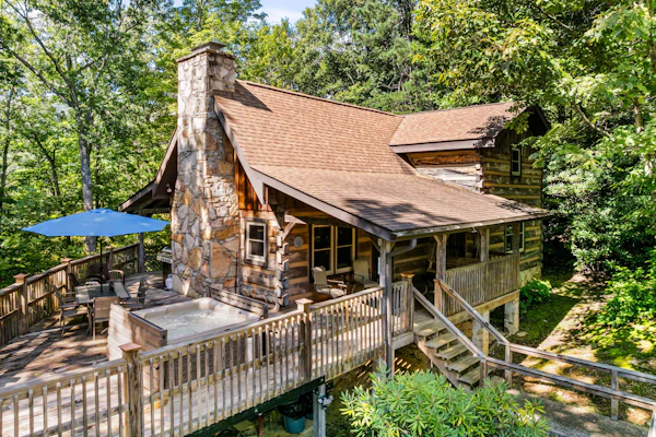 Breathtaking Mountain Color + That Down Home Feeling You’ll Crave Again and Again. Nestled in a charming Gatlinburg neighborhood, this stunning 4-bedroom log cabin sleeps 12 and is packed with experiences. Relax in the bubbling hot tub, share laughs around the table and arcade games, or simply take in breathtaking mountain color from your deck. With cozy spaces, southern hospitality, and easy access to the best of the Smokies, this is the cabin you’ll want to book before it’s gone!