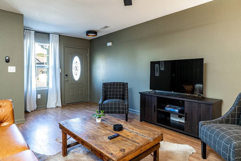 Escape to the Smoky Mountains in this pet-friendly cabin retreat with a private patio and hot tub, perfect for unwinding after exploring nearby attractions like Dollywood and The Island. Enjoy arcade games, a spacious open floor plan, Roku Smart TV, high-speed WiFi, and a fully equipped kitchen. With room to sleep 6, keyless entry, and in-unit washer and dryer, it's ideal for family getaways or group vacations. Book your perfect Pigeon Forge stay today!