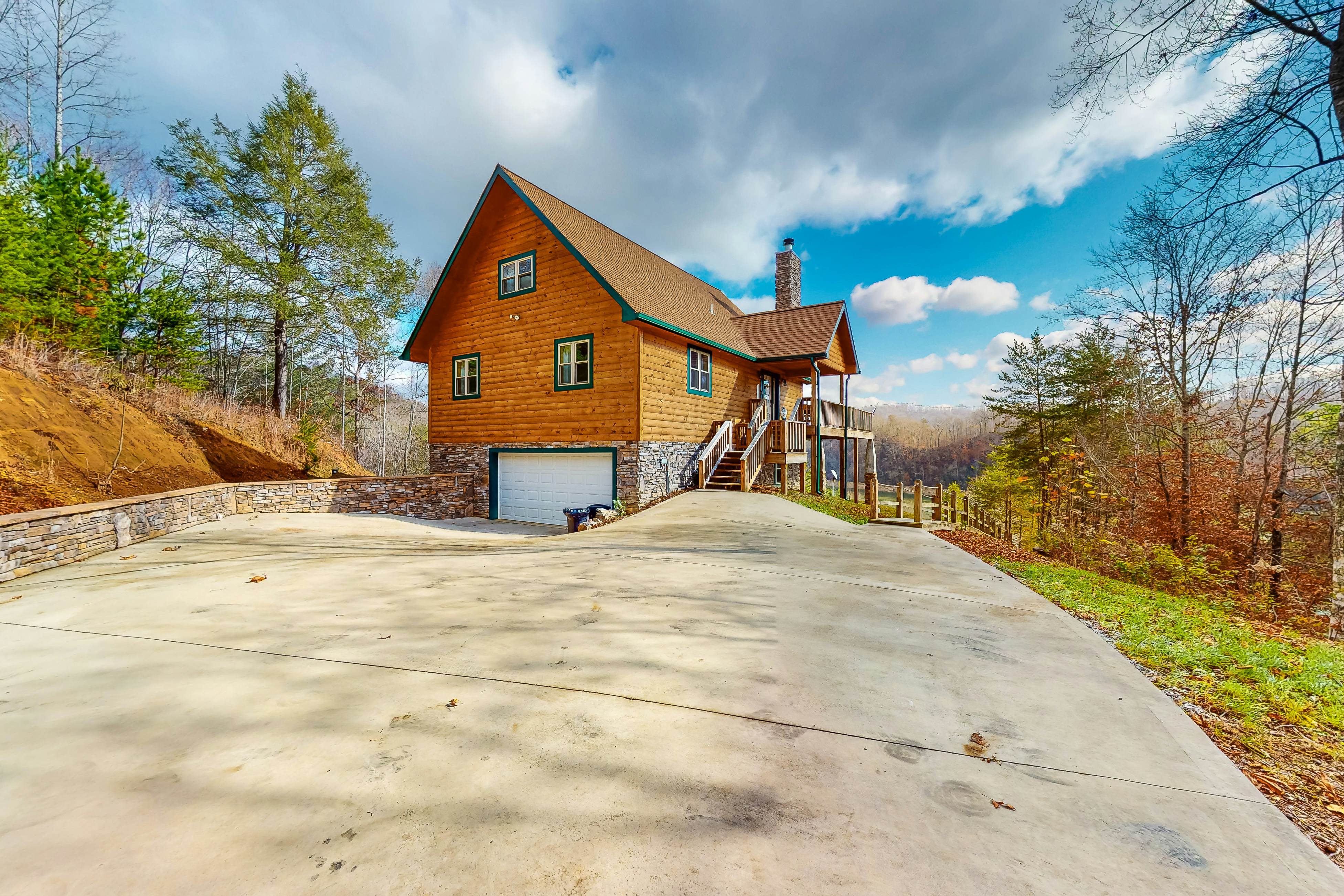 Dog-friendly lakefront house with hot tub, central AC, & mountain view