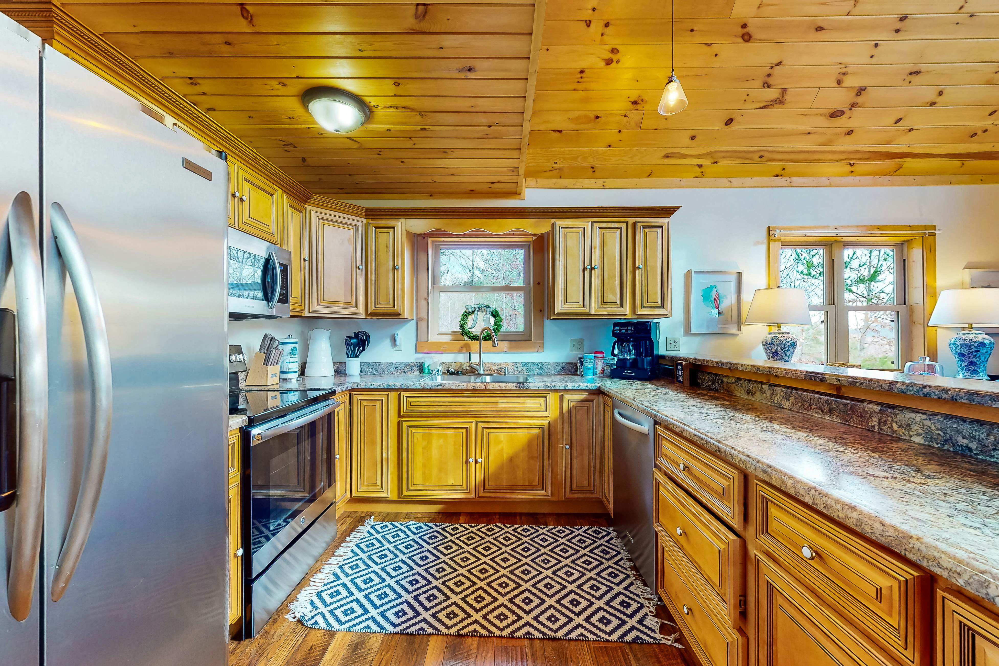 Dog-friendly lakefront house with hot tub, central AC, & mountain view