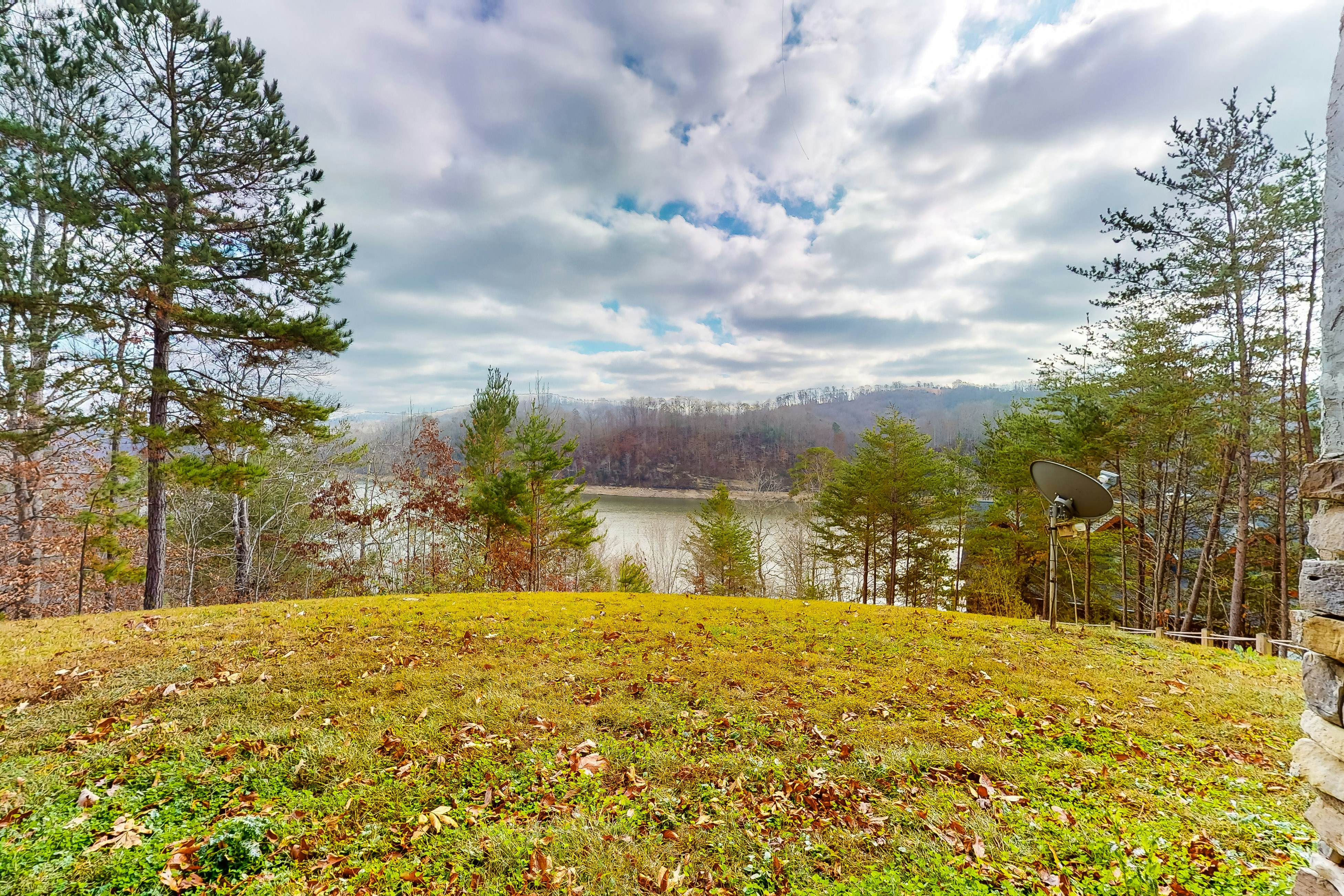 Dog-friendly lakefront house with hot tub, central AC, & mountain view