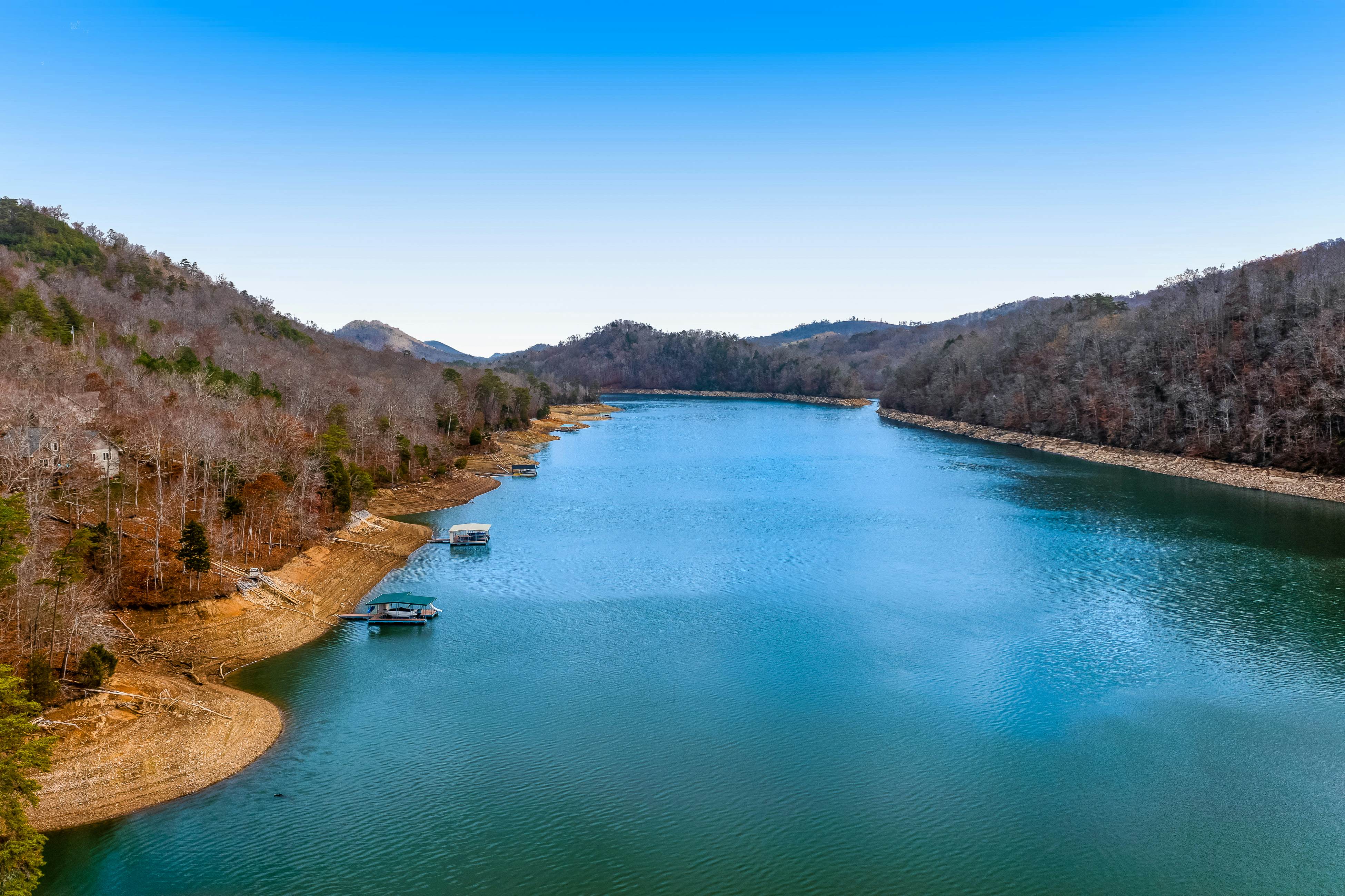 Dog-friendly lakefront house with hot tub, central AC, & mountain view