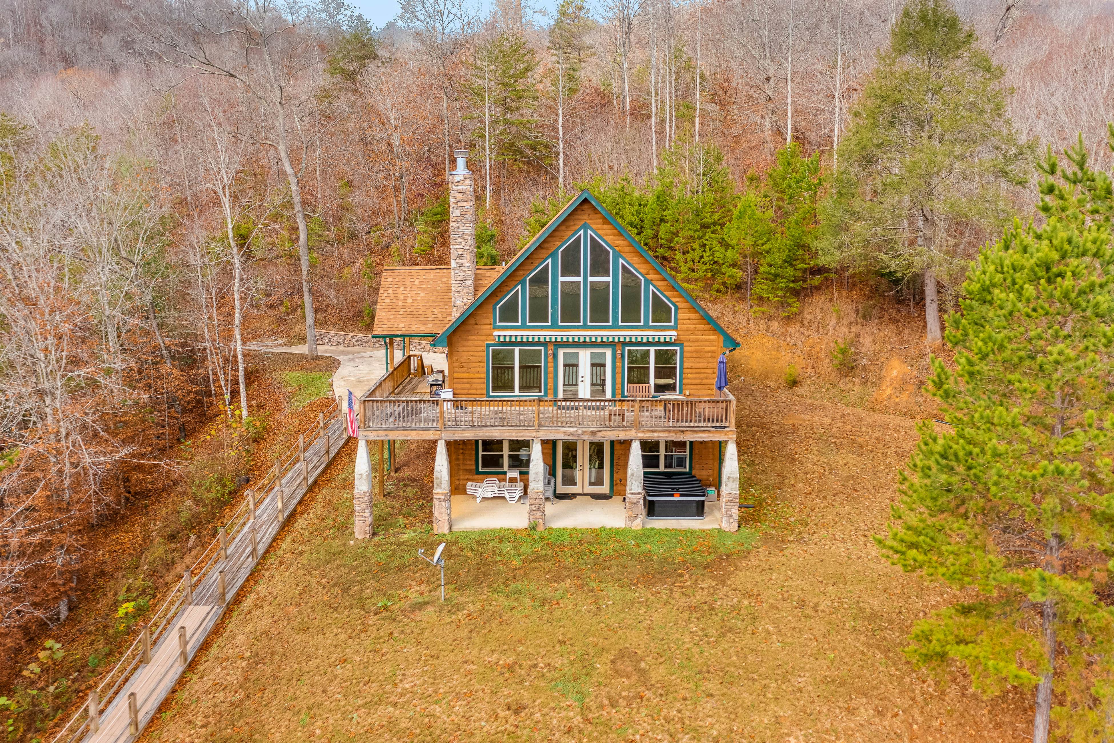 Dog-friendly lakefront house with hot tub, central AC, & mountain view