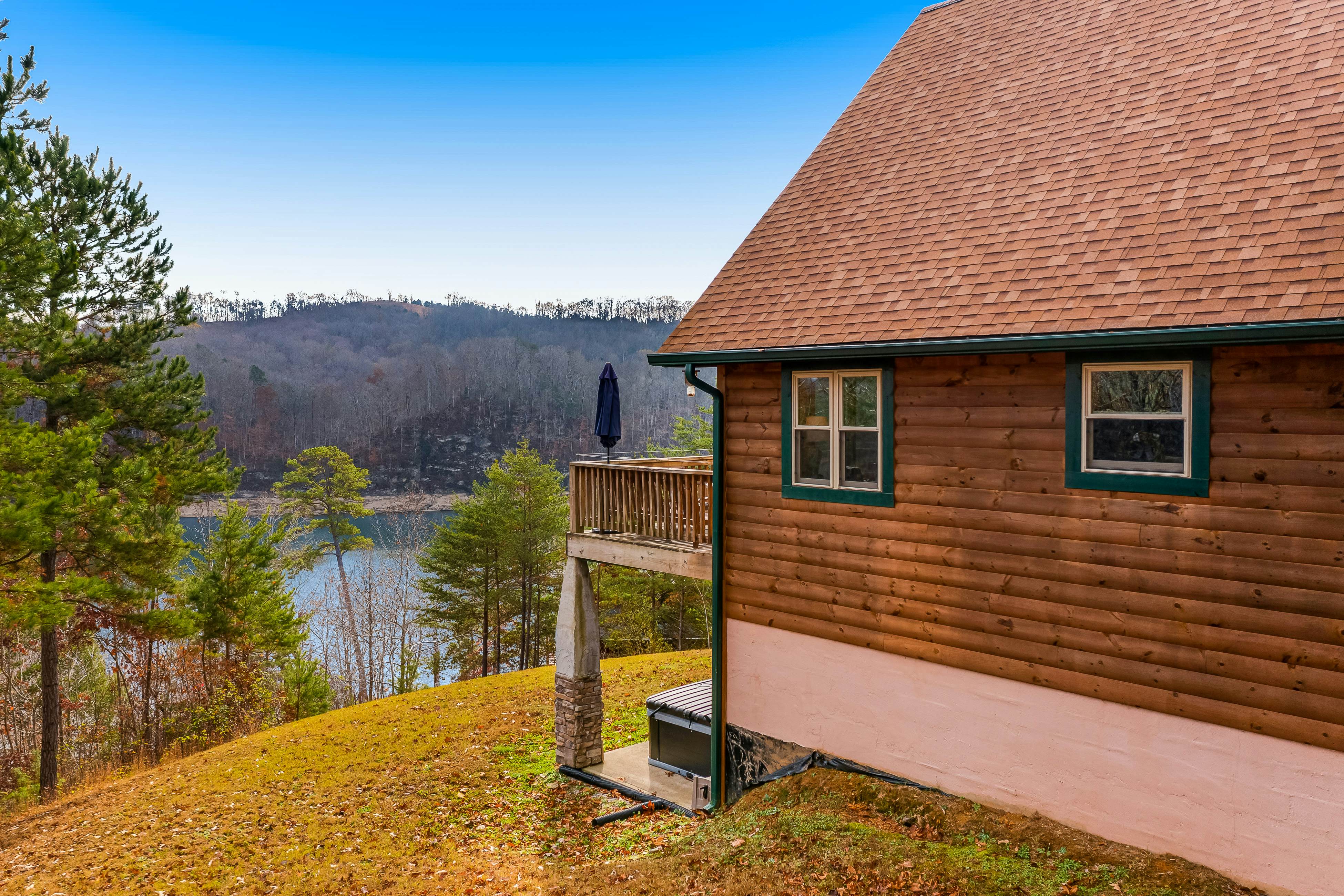 Dog-friendly lakefront house with hot tub, central AC, & mountain view