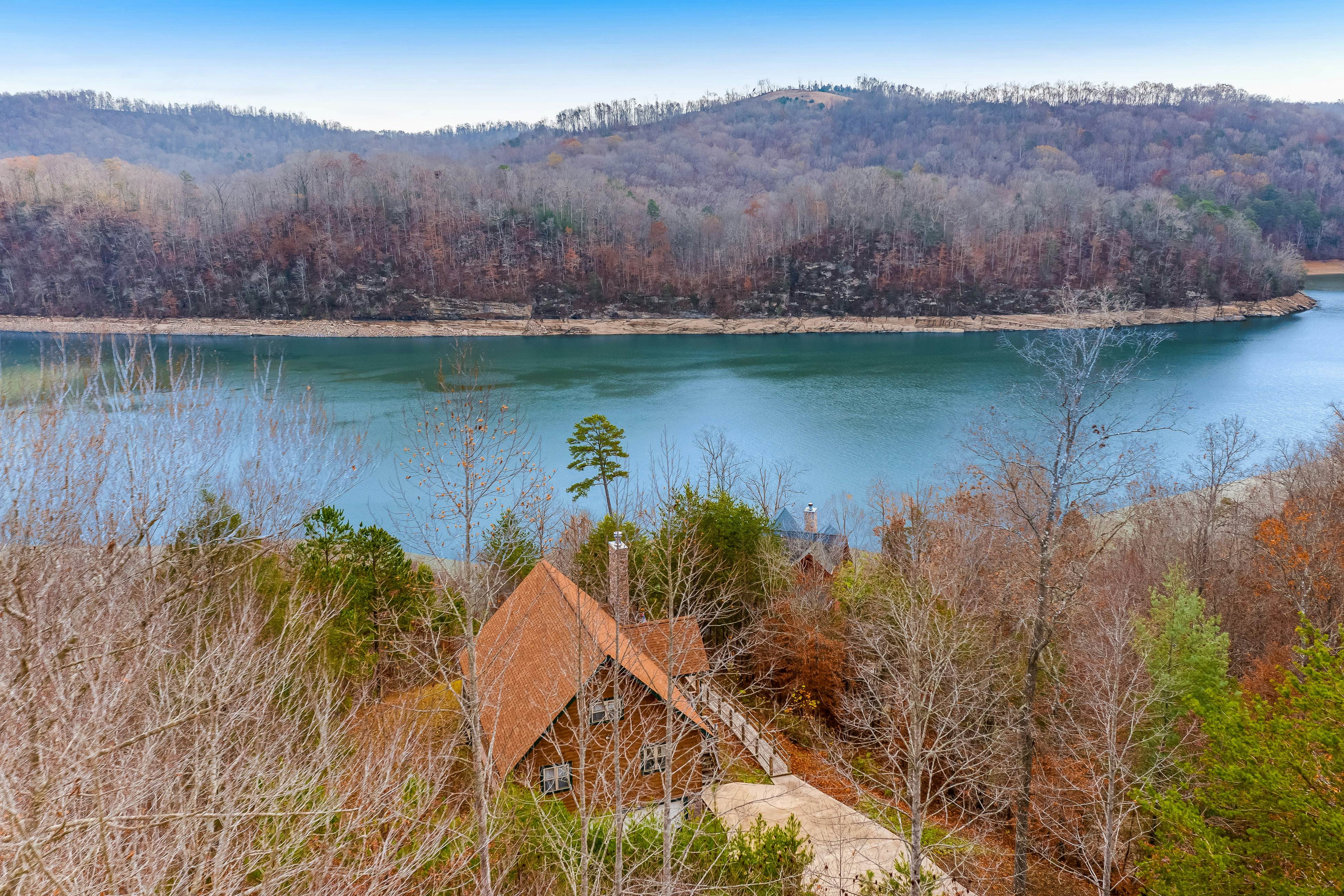 Dog-friendly lakefront house with hot tub, central AC, & mountain view