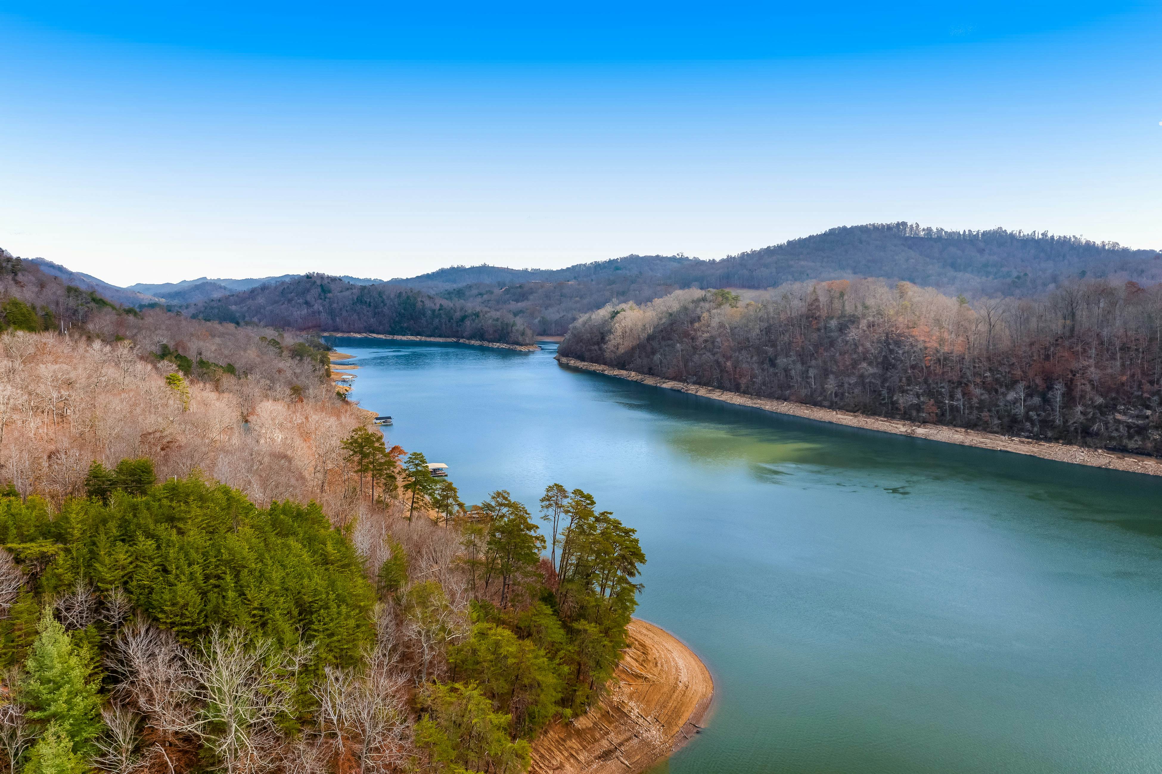 Dog-friendly lakefront house with hot tub, central AC, & mountain view