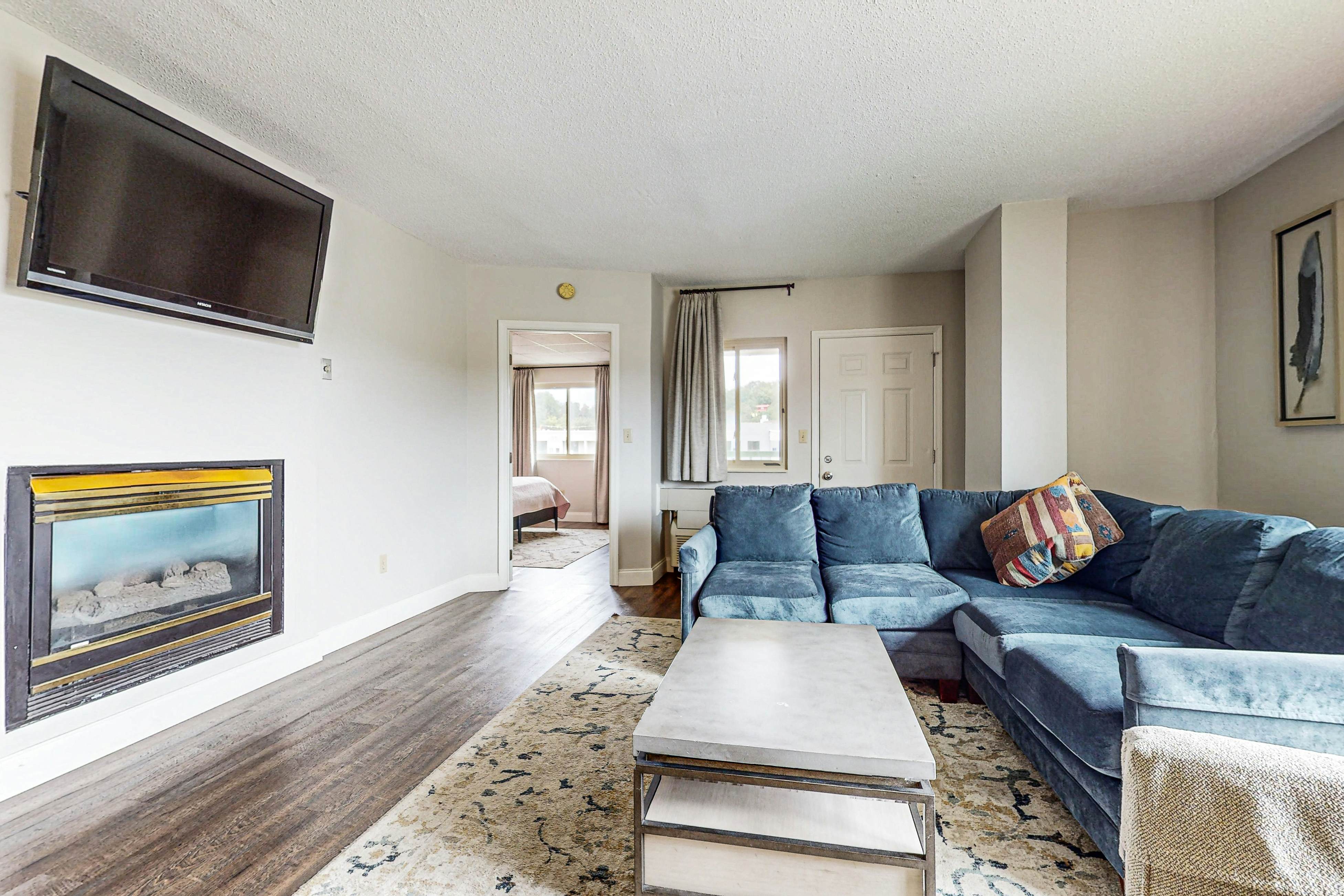 Stylish Riverview Corner Unit with Free Attraction Tickets, Balcony, & Fireplace