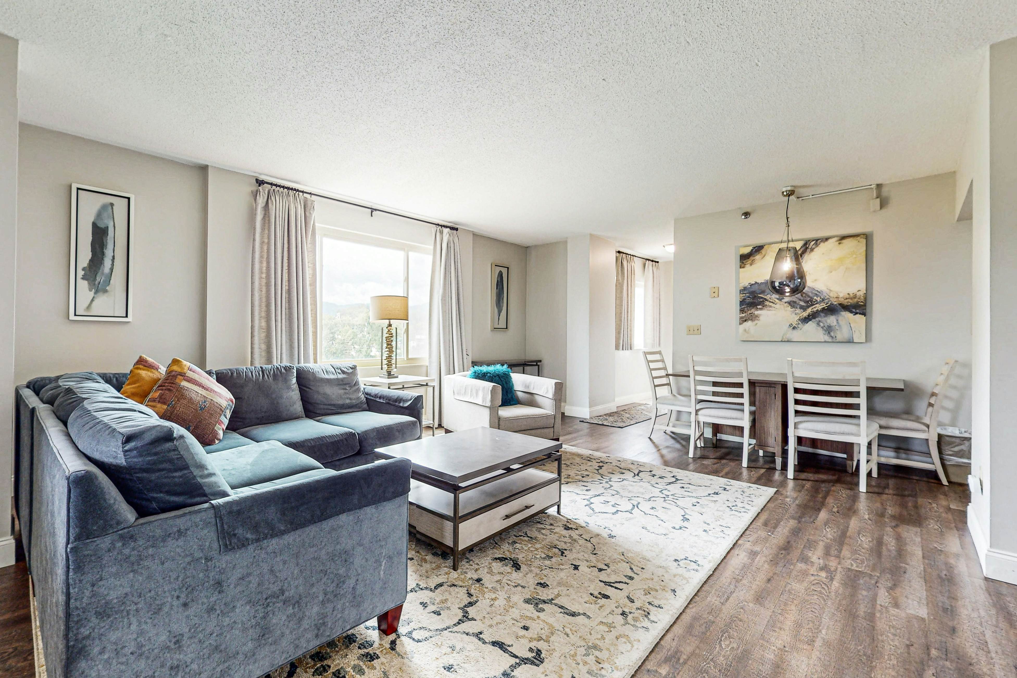 Stylish Riverview Corner Unit with Free Attraction Tickets, Balcony, & Fireplace