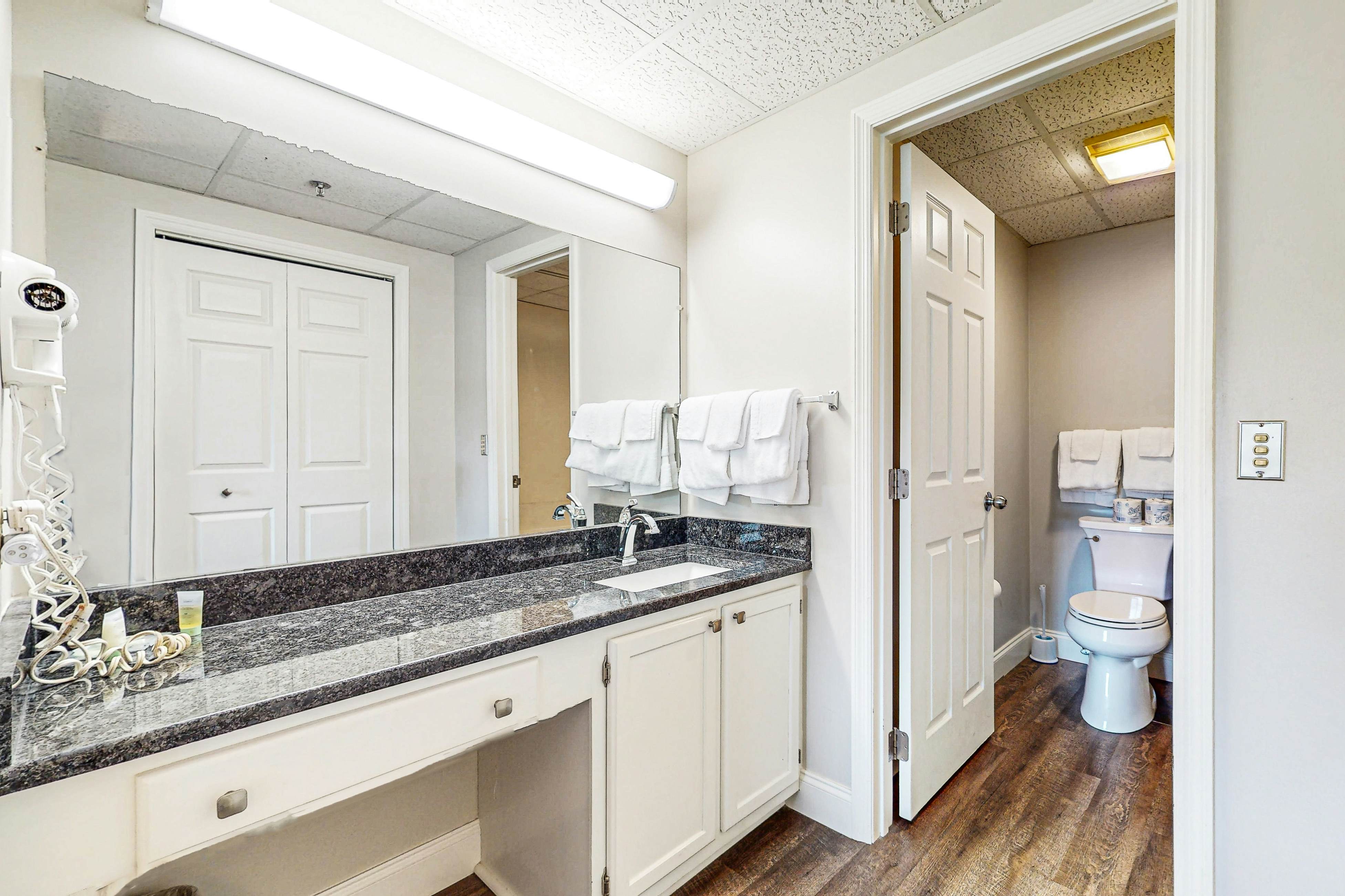 Stylish Riverview Corner Unit with Free Attraction Tickets, Balcony, & Fireplace